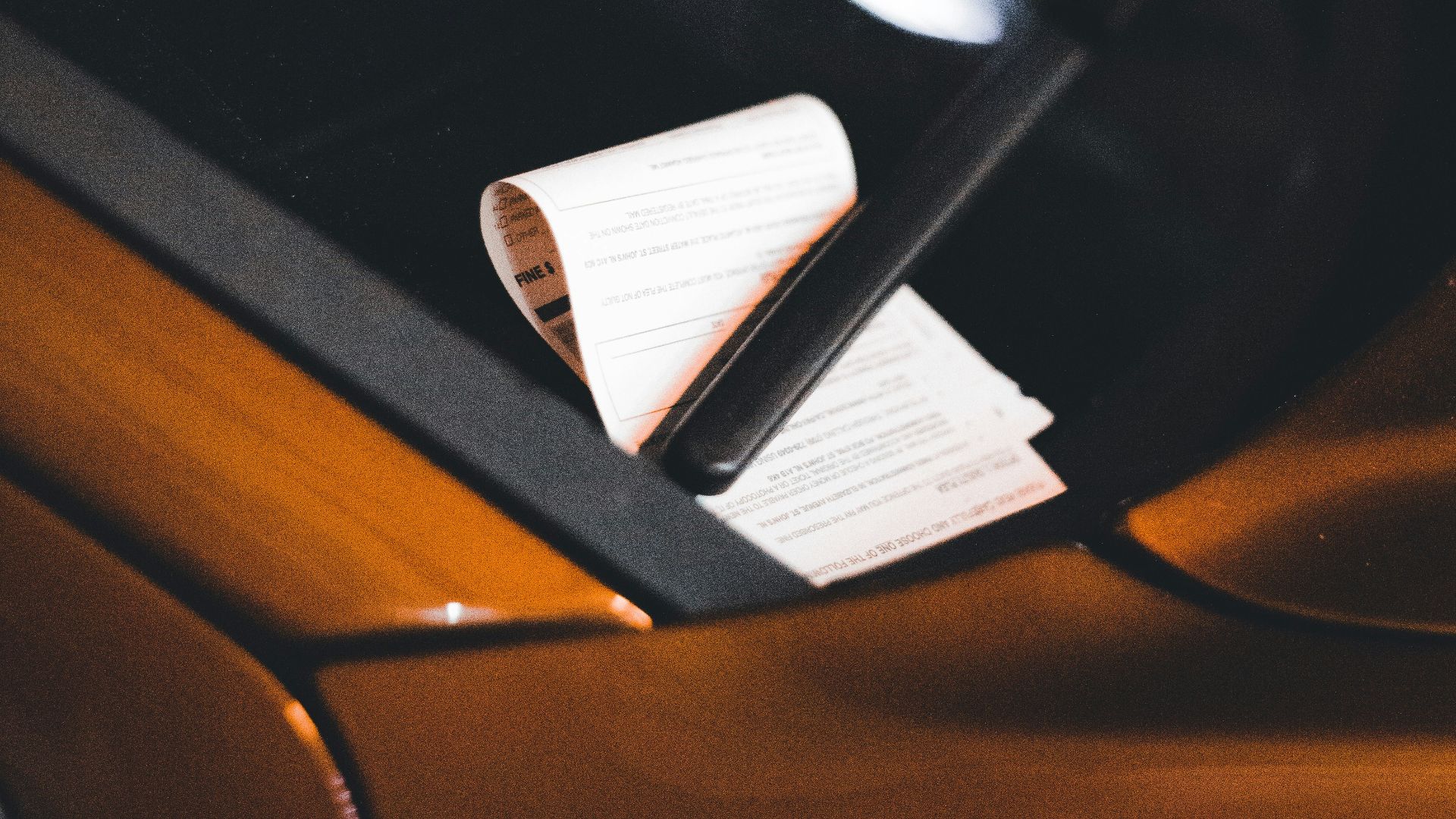 a black and white object with a white tag on it