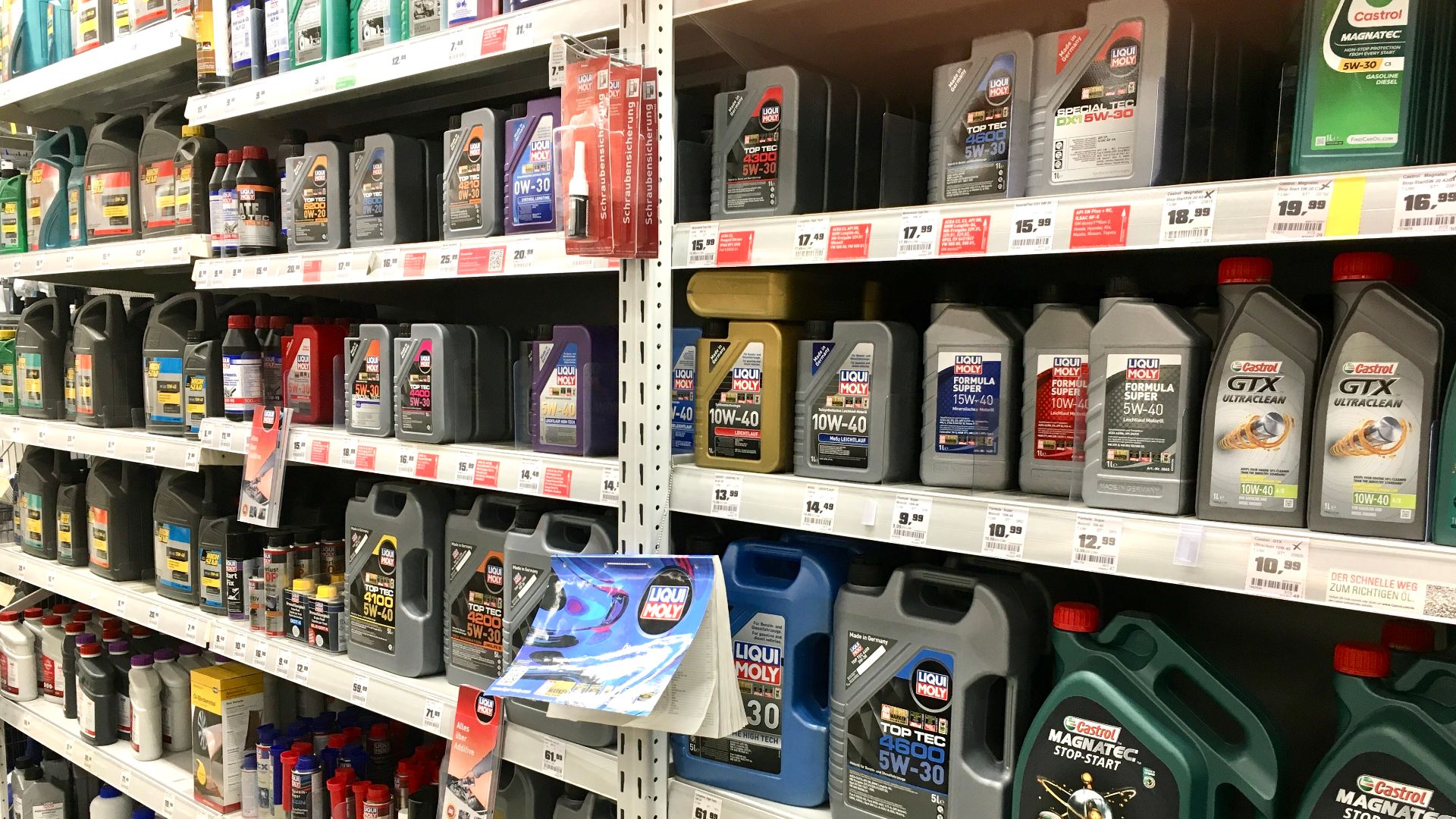 Motor oil for cars and motorcycles from various producers in German hardware store