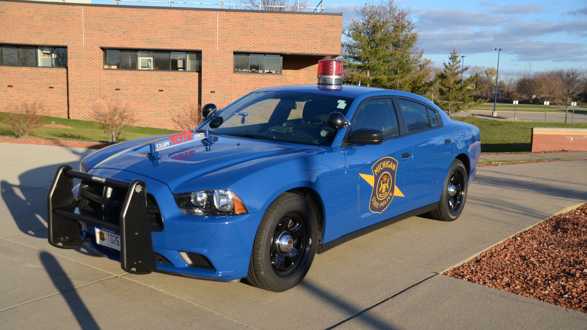 Michigan State Police cars parked in front of the State Police Training Academy in Dimondale, Michigan on a nice fall evening.
Taken October 27, 2012