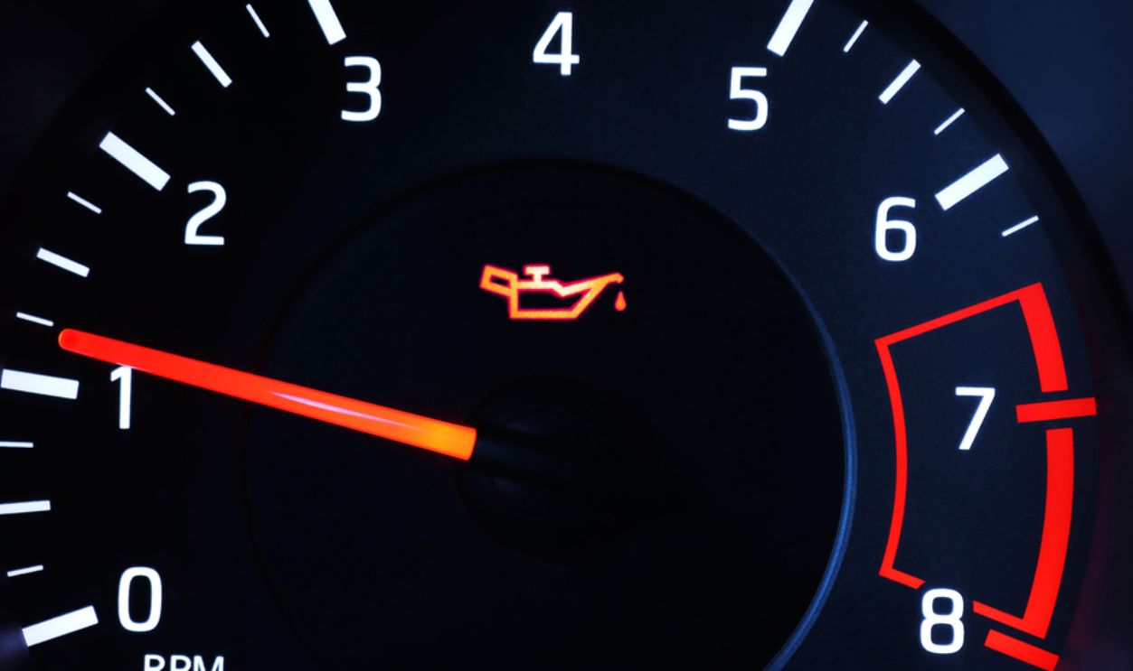 Oil pressure warning light illuminated on dashboard.