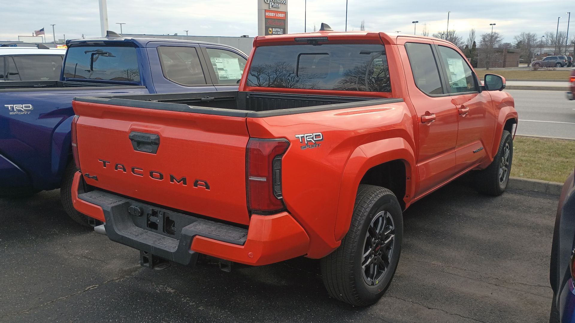 Rear view of a 2024 Toyota Tacoma TRD Sport Double Cab midsize pickup truck.