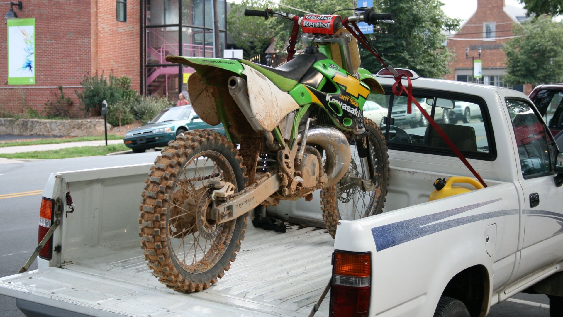 Dirt bike fixed to a truck bed on Franklin Street in Chapel Hill, North Carolina.