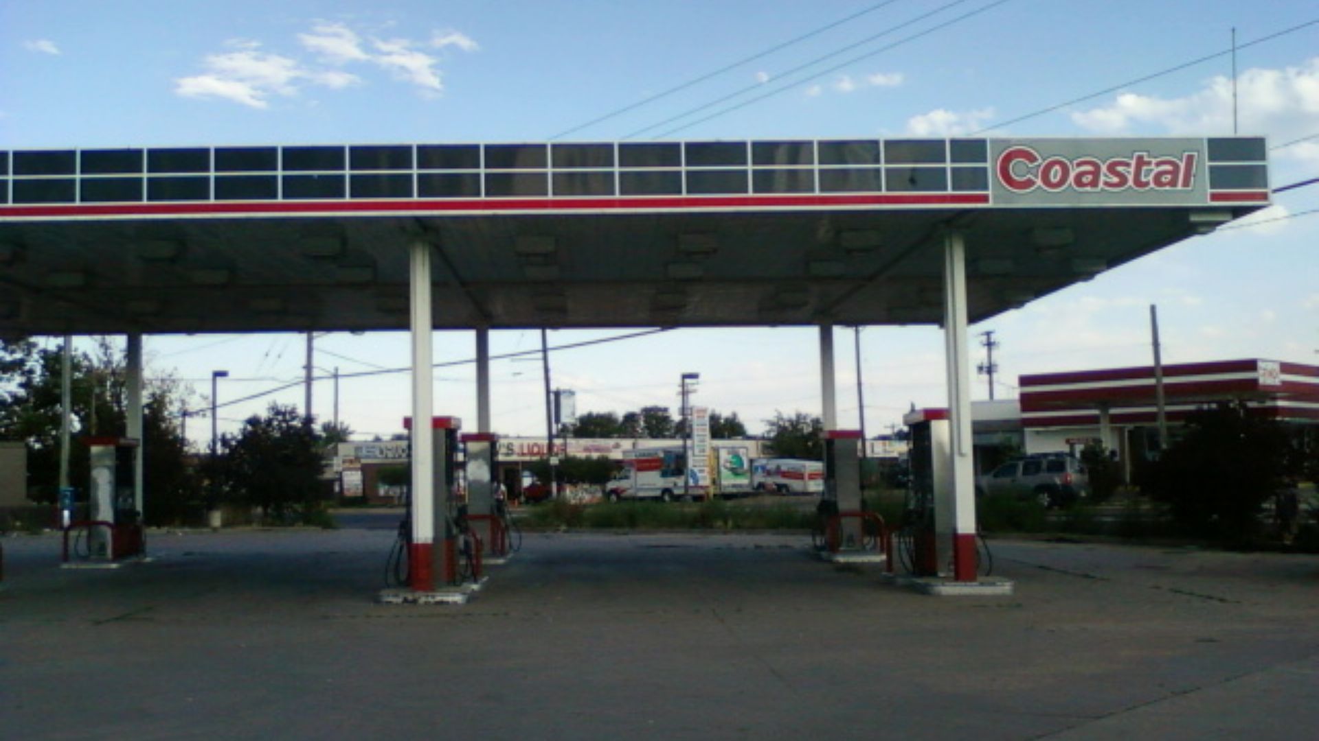 A former Coastal brand gas station, which was more recently another brand, but after closing, canopy was stripped revealing original signage.