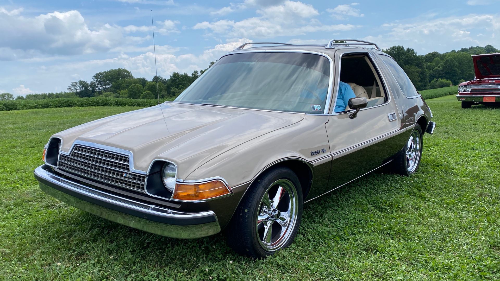 1978 AMC Pacer D/L coupe made by American Motors Corporation (AMC). This car is finished in factory two-tone Khaki and British Bronze and has a matching original interior color and upholstery with the standard individually adjustable and reclining front s