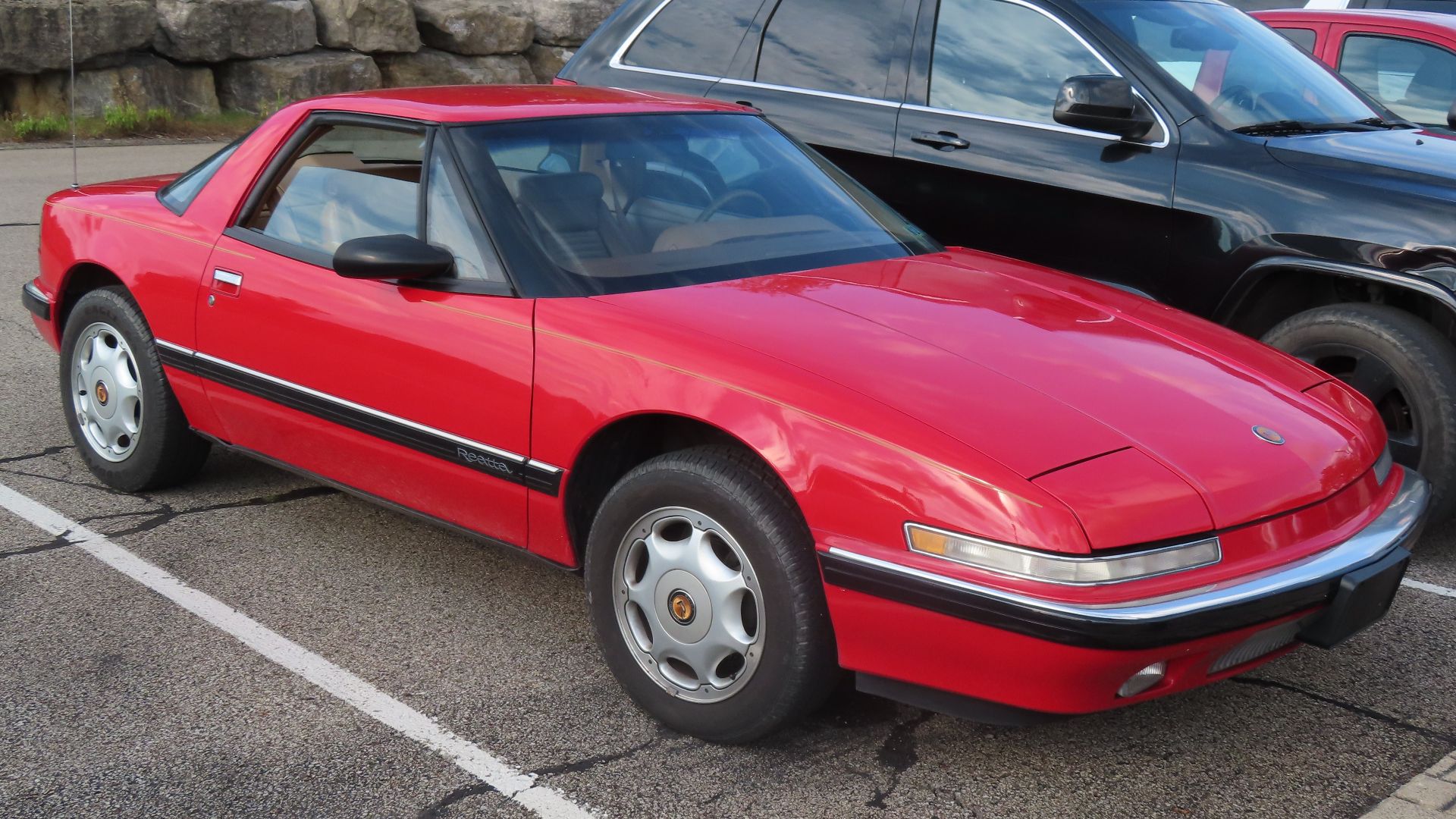 1991 Buick Reatta coupe photographed in Ellwood City, Pennsylvania. The Buick Reatta was sold for the 1988-1991 model years. It was initially only available as a coupe, but a convertible joined the lineup for 1990. The rims seen on this Reatta were exclus