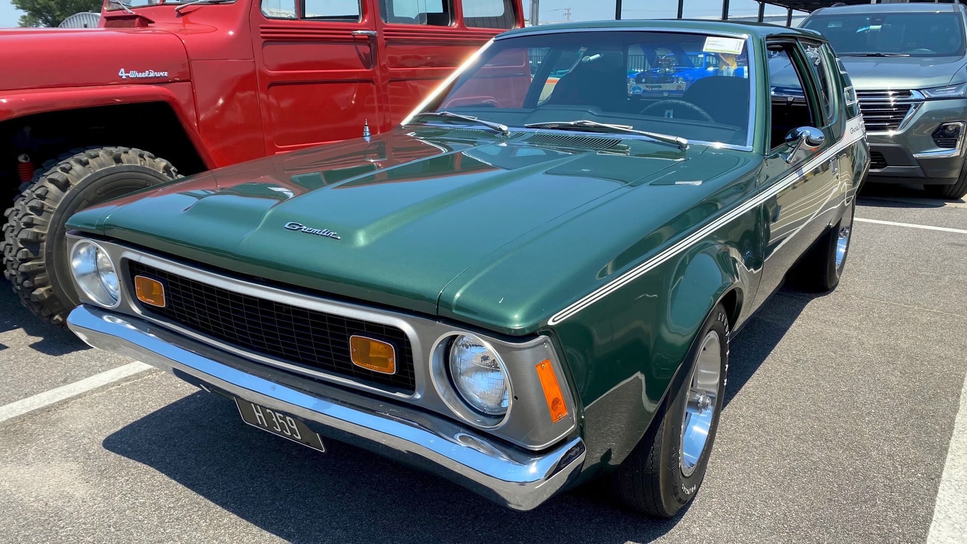 1972 AMC Gremlin X model -  An innovative sub-compact car made by American Motors Corporation (AMC). This car is finished in Hunter Green Metallic with white body side stripes, and the standard bucket seat interior in black. This car has the optional 304 