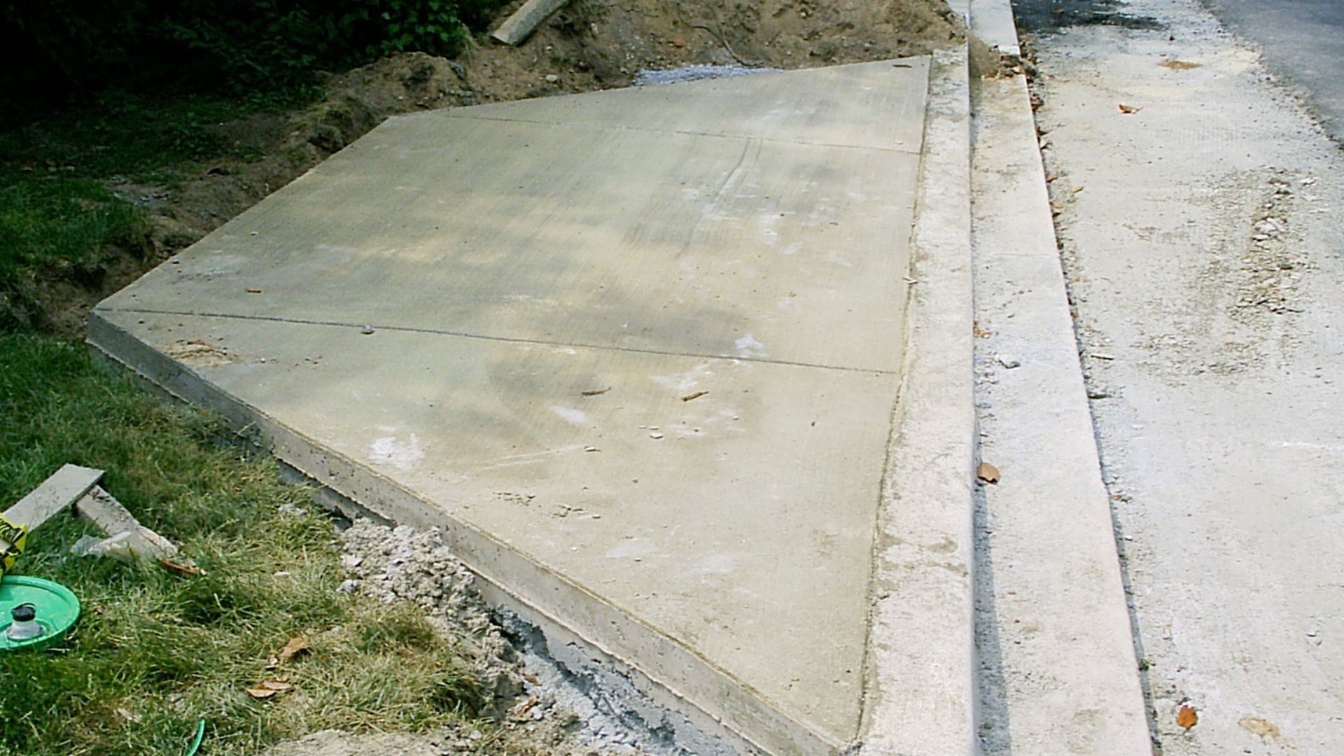 Driveway apron and sloped curb to public street (all under construction)