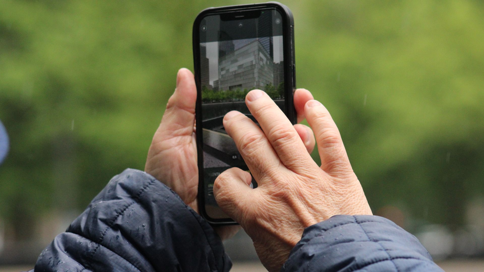 A man using a cell phone to take a photo