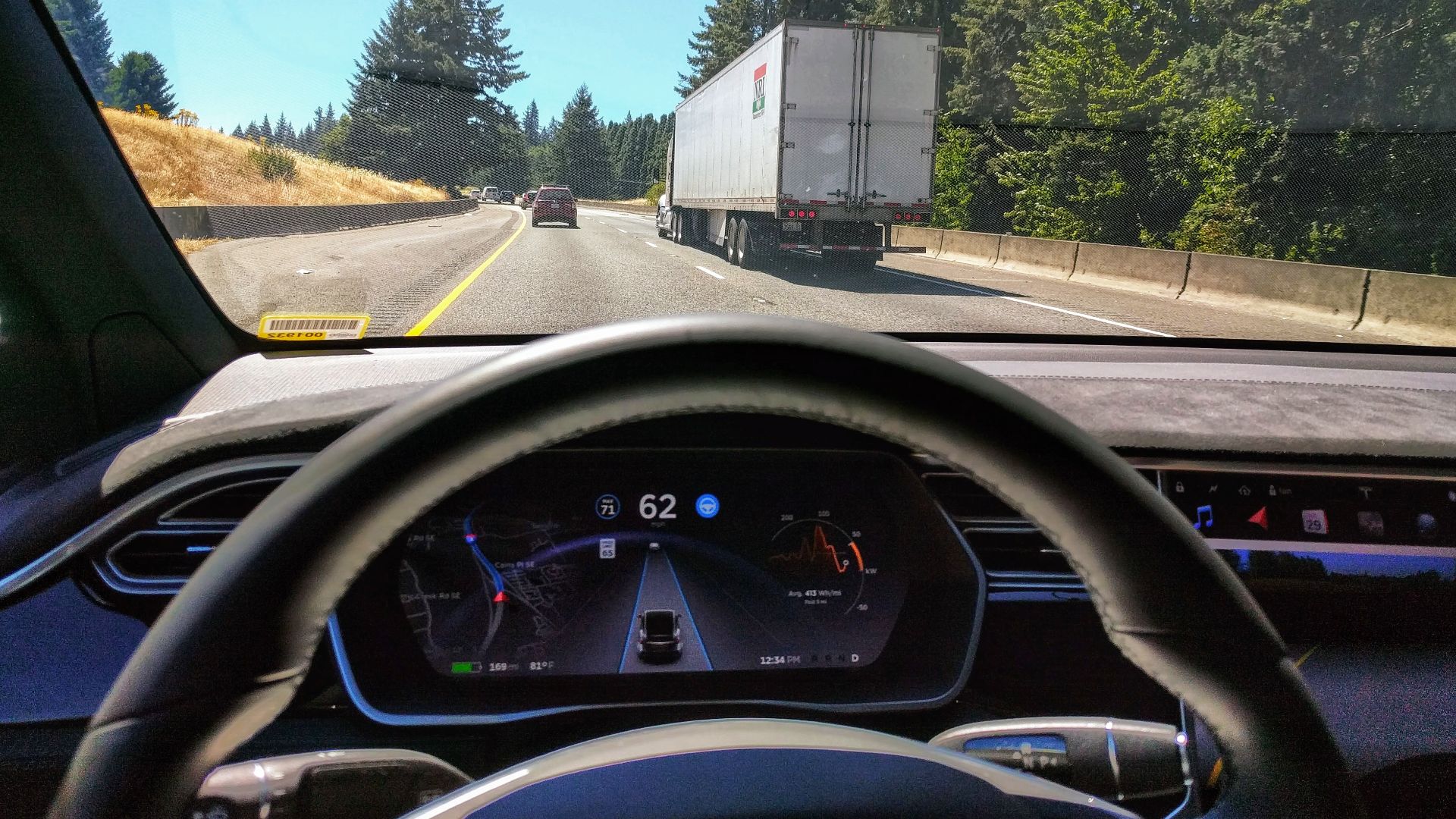 Driving in traffic with Tesla's autopilot controlling distance from the lead car and centering the vehicle in the lane.
Vehicle is a 2017 Model X 75D with dark interior.