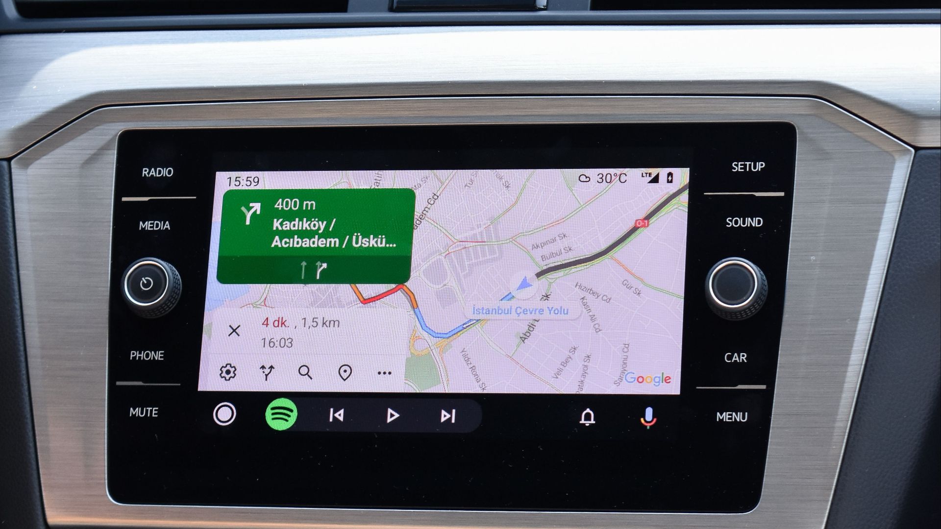 Close-up of a car GPS navigation system inside a Volkswagen Passat dashboard.