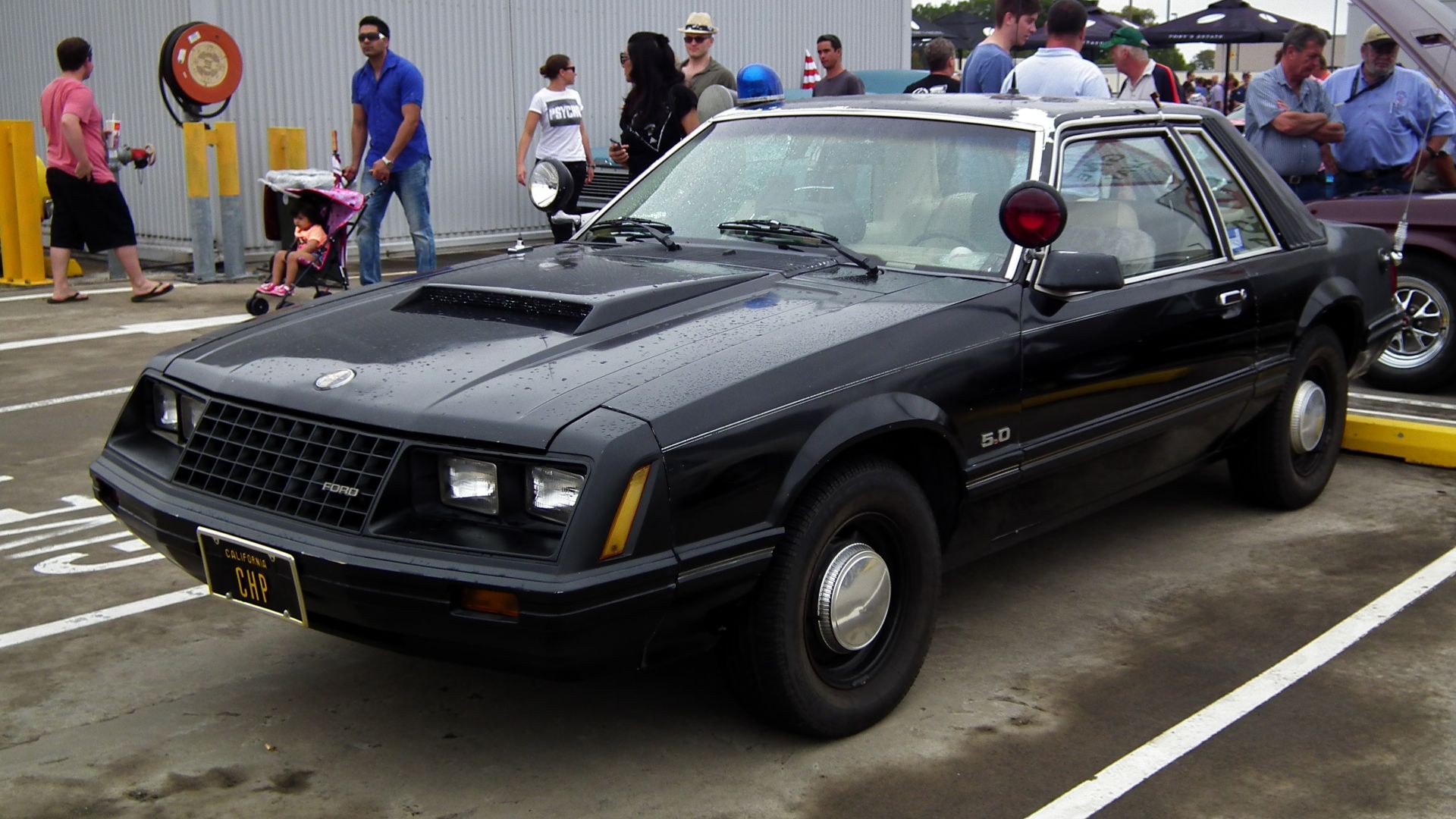 1982 Ford Mustang coupe. Former California Highway Patrol car. Taken at the 2013 New South Wales All American Day, held at Castle Towers Shopping Centre, Castle Hill, Sydney.