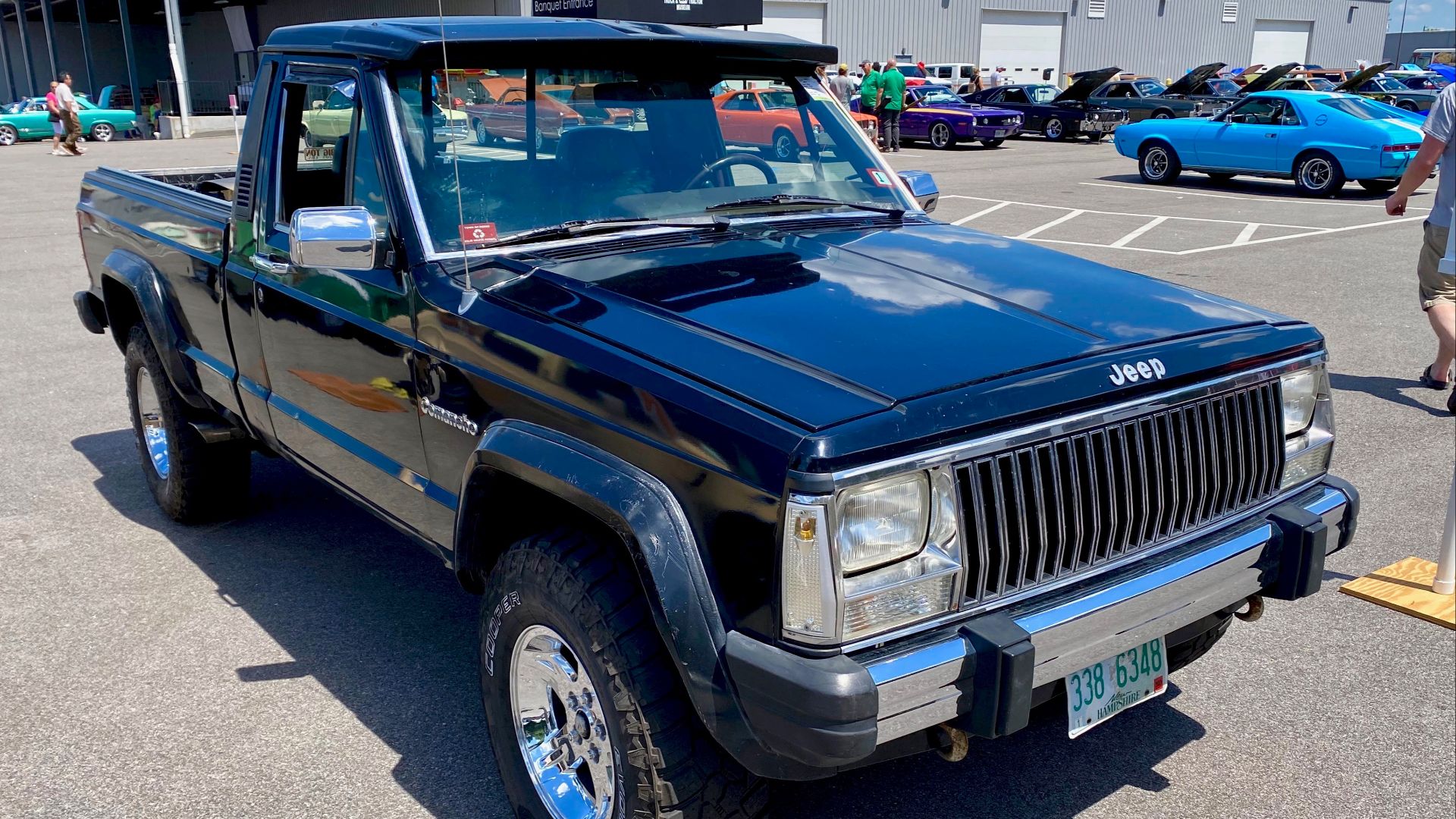 1988 Jeep Comanche 4x4 7-foot long-bed pickup truck finished in black equipped with AMC's 4.0 L engine and a steering column automatic transmission shifter. Interior has Jeep