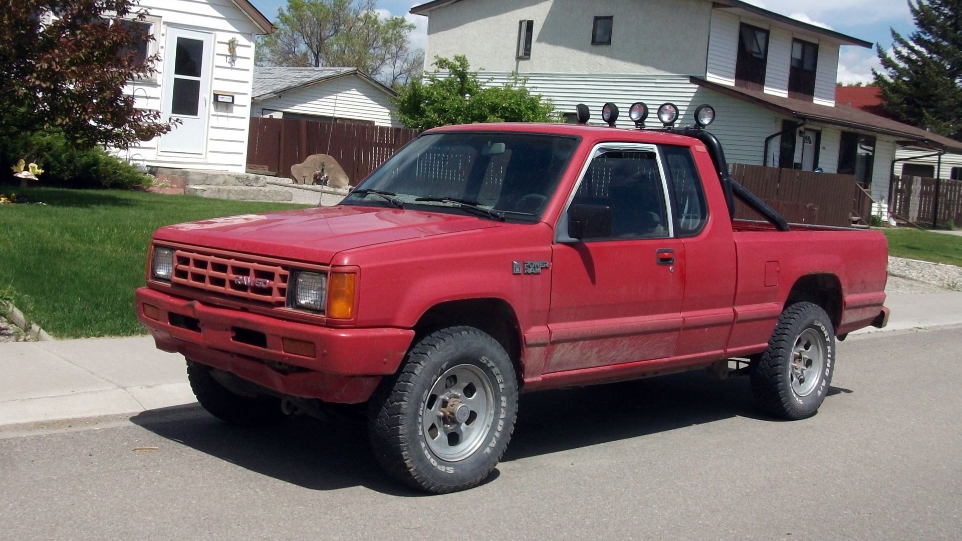A Dodge Power Ram which was a badge engineered Mitsubishi truck. This one is a super cab and looks to be a 4x4 as well.