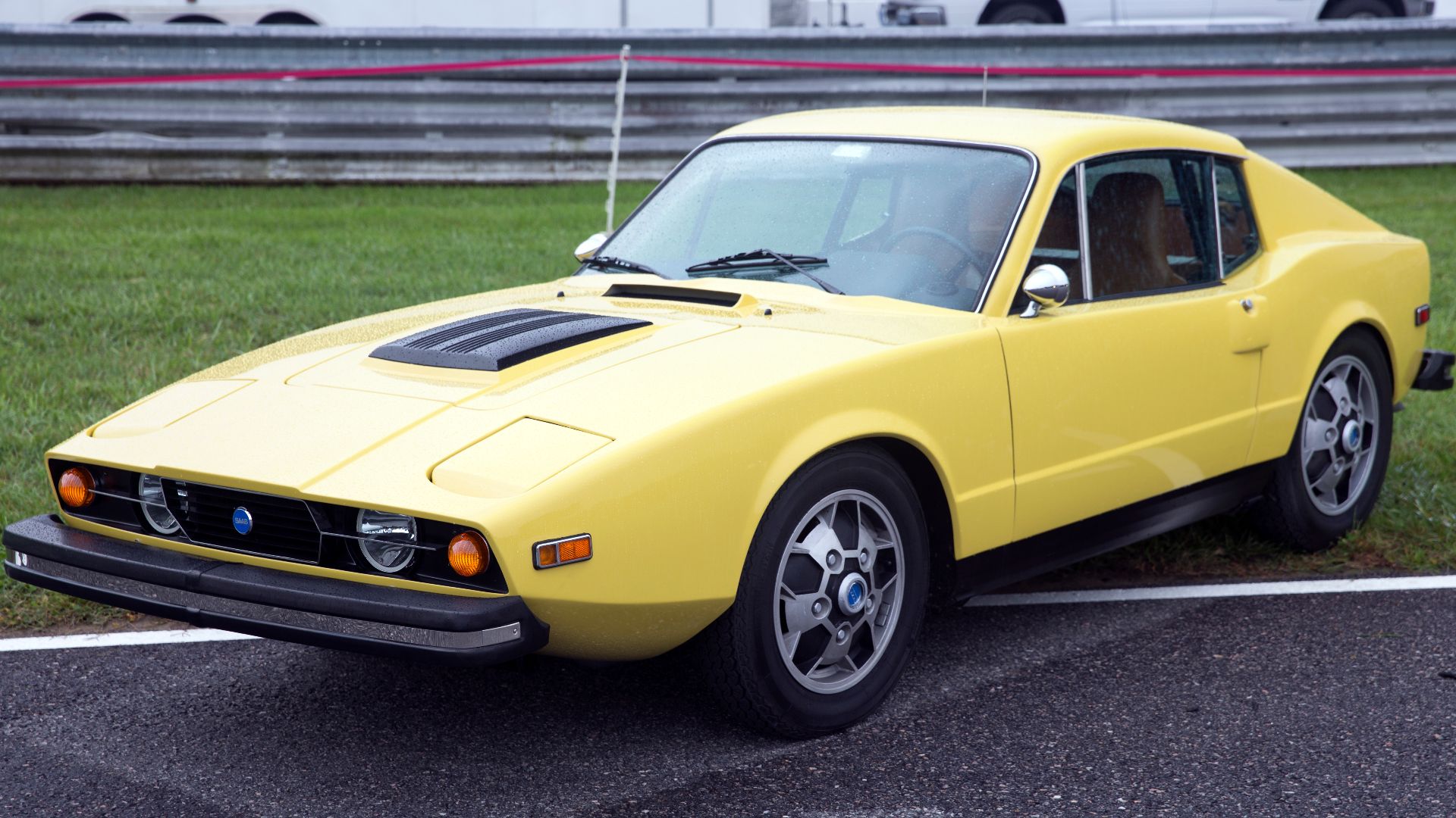 1974 Saab Sonett III at the 2021 Lime Rock Historic Festival Concours d'Élegance. Very nice car; these chrome Talbot-style rear view mirrors were a dealer-installed option in the US - a black and more square style was also used.