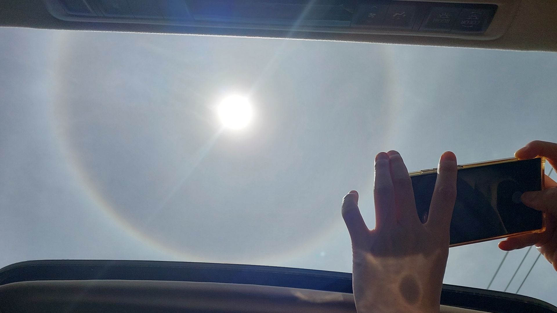 taking an image of a halo around the sun in Khon Kaen, Thailand from a sunroof