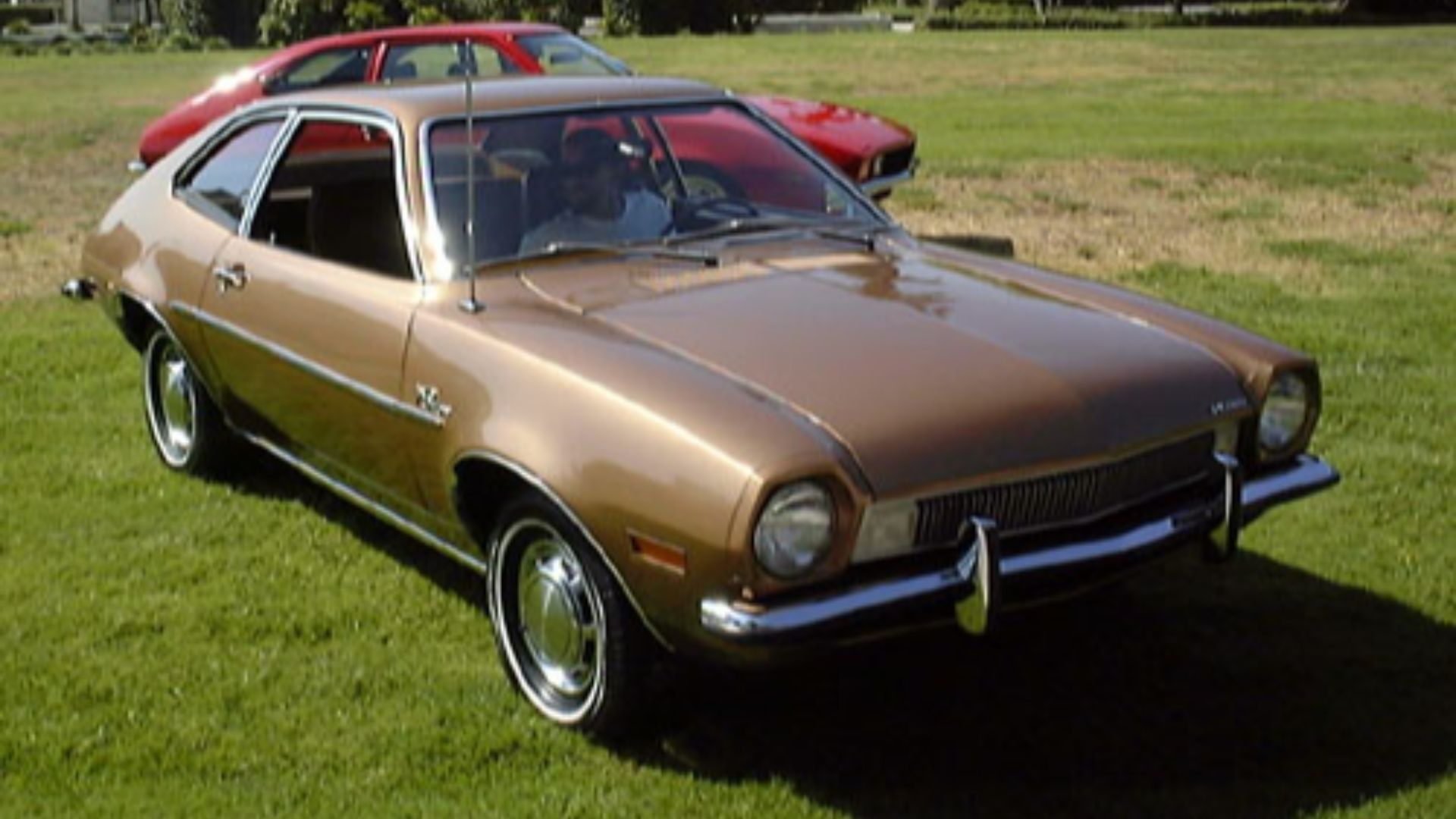 Ford Pinto.  Foreground car is a restored example; background is a hot-rodded version with popup headlights.
