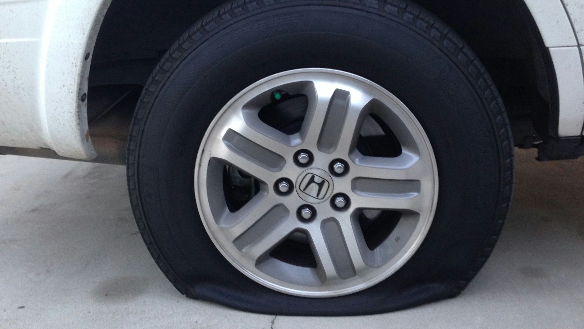 gray 5 spoke wheel with tire
