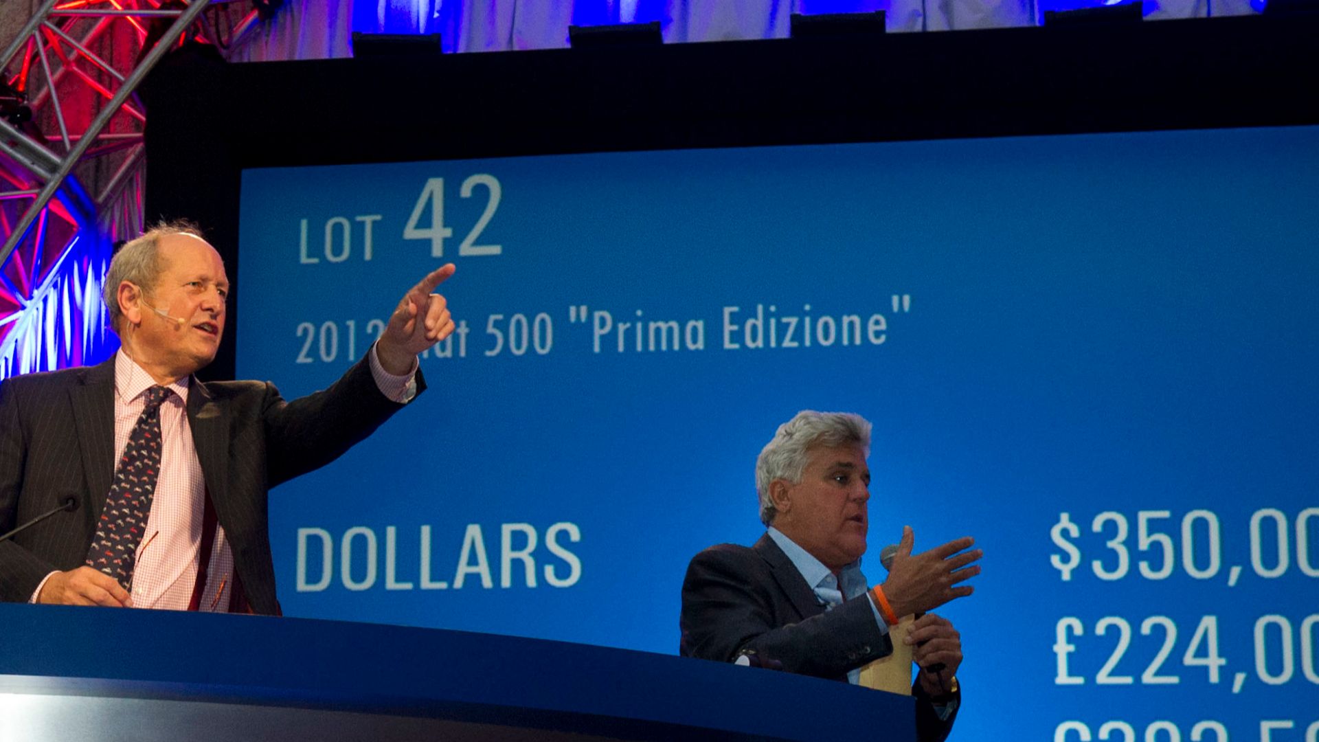Auctioneer Charles Ross, center, and comedian Jay Leno call for bidding on a Fiat 500 Prima Edizione at a car auction in Pebble Beach, Calif., Aug. 18, 2012. DOD photo by Erin A. Kirk-Cuomo