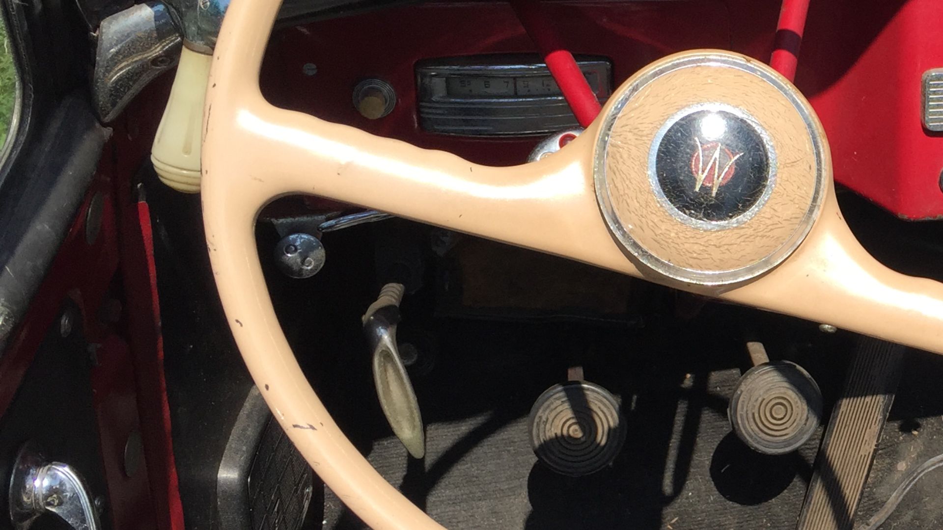 1950 Willys Jeepster, a phaeton/convertible produced by Willys-Overland Motors from 1948 to 1950, with some leftover units sold as 1951 model year cars. This is a six-cylinder model finished in two-tone red and black. Picture taken at the 52nd Annual