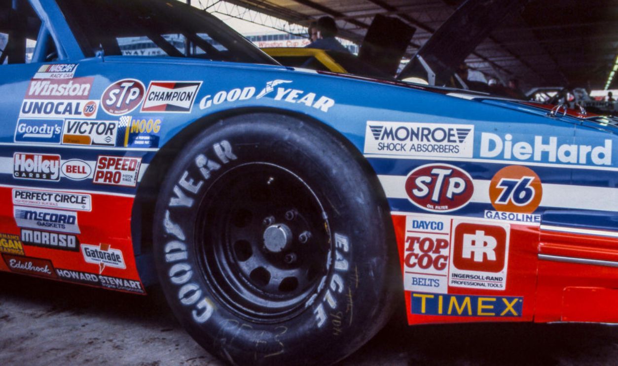 HAMPTON, GA - NOVEMBER 03: Contingency sponsor stickers are shown on the fender of the #43 STP Pontiac of Richard Petty in the garage before the Atlanta Journal 500 NASCAR Winston Cup race at Atlanta Motor Speedway, NOVEMBER 03, 1985 in Hampton, GA. 