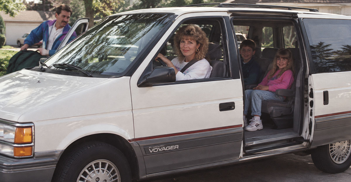 A family in a minivan in the 1990s