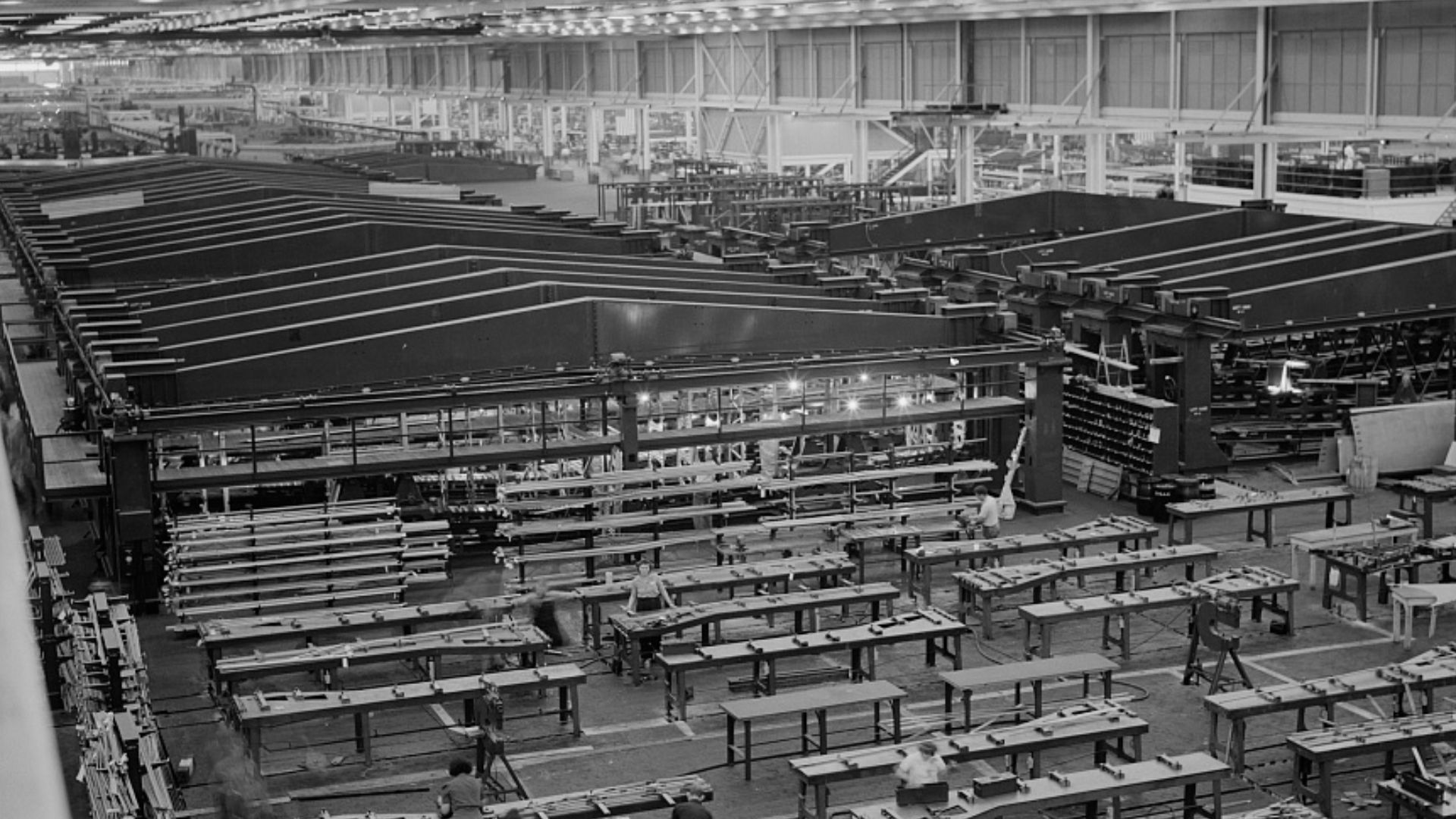 A small part of the world's largest one-story war production plant, the giant bomber factory at Willow Run, Michigan. Fixtures in background hold bomber wings during assembly. Ford plant, Willow Run