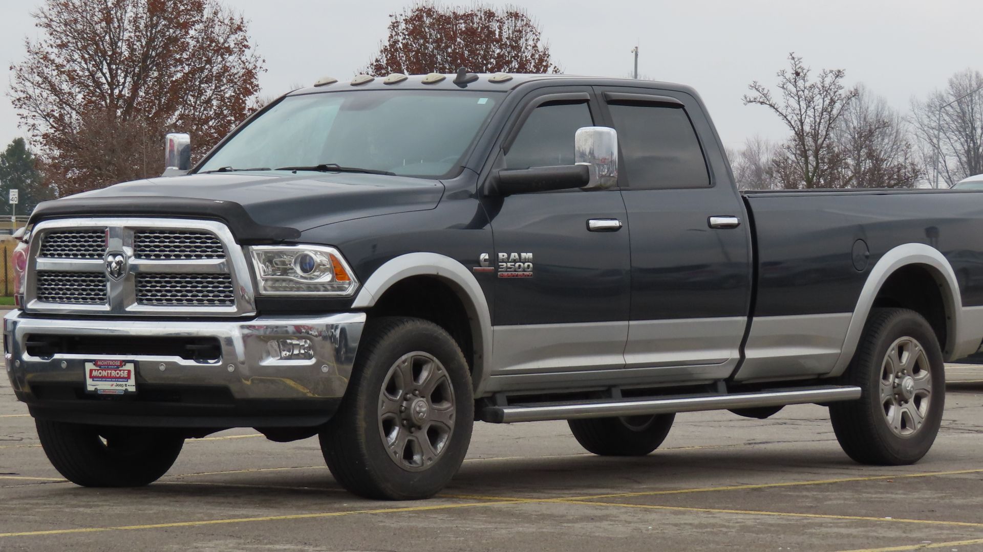2018 Ram 3500 Laramie Crew Cab 4x4 with 8' Box photographed in New Castle, Pennsylvania. Finished in Maximum Steel over Silver.