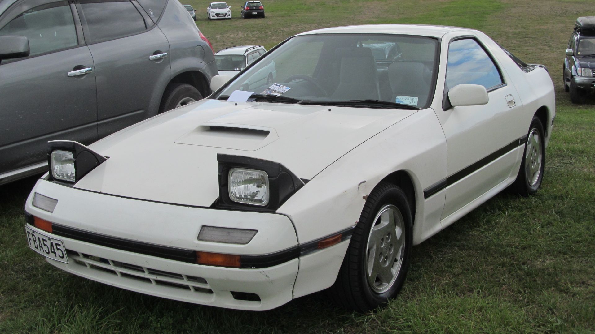 I was extremely happy to see this, as it's probably one of the most original second-gen RXs still about, and one of comparatively few still around (though a heavily modified red one lives on my street.). These were designed with more than a little Porsche