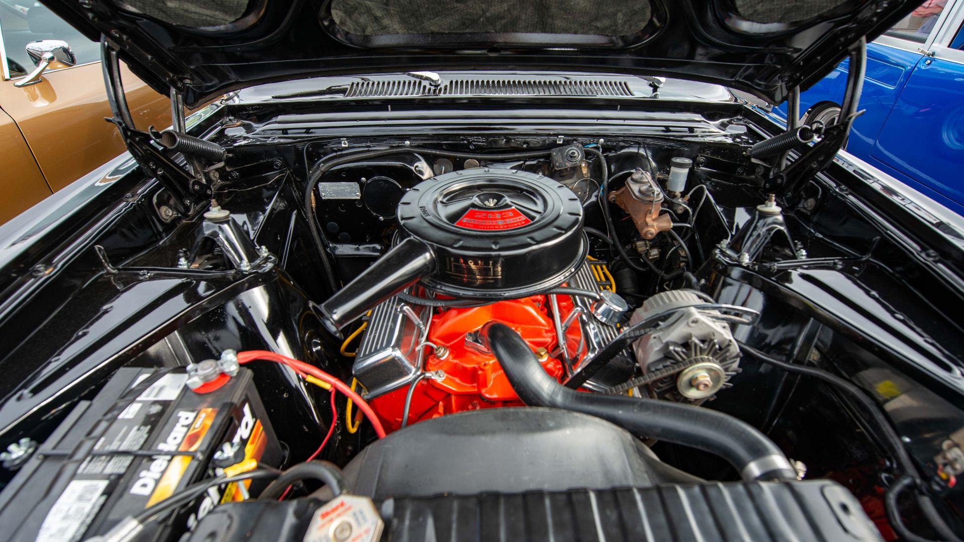 Detailed view of a vintage car engine highlighting its mechanics.