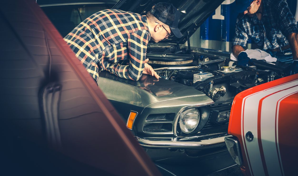 Two Guys Restoring Their Another American Classic Muscle Car. Automotive Industry Theme.