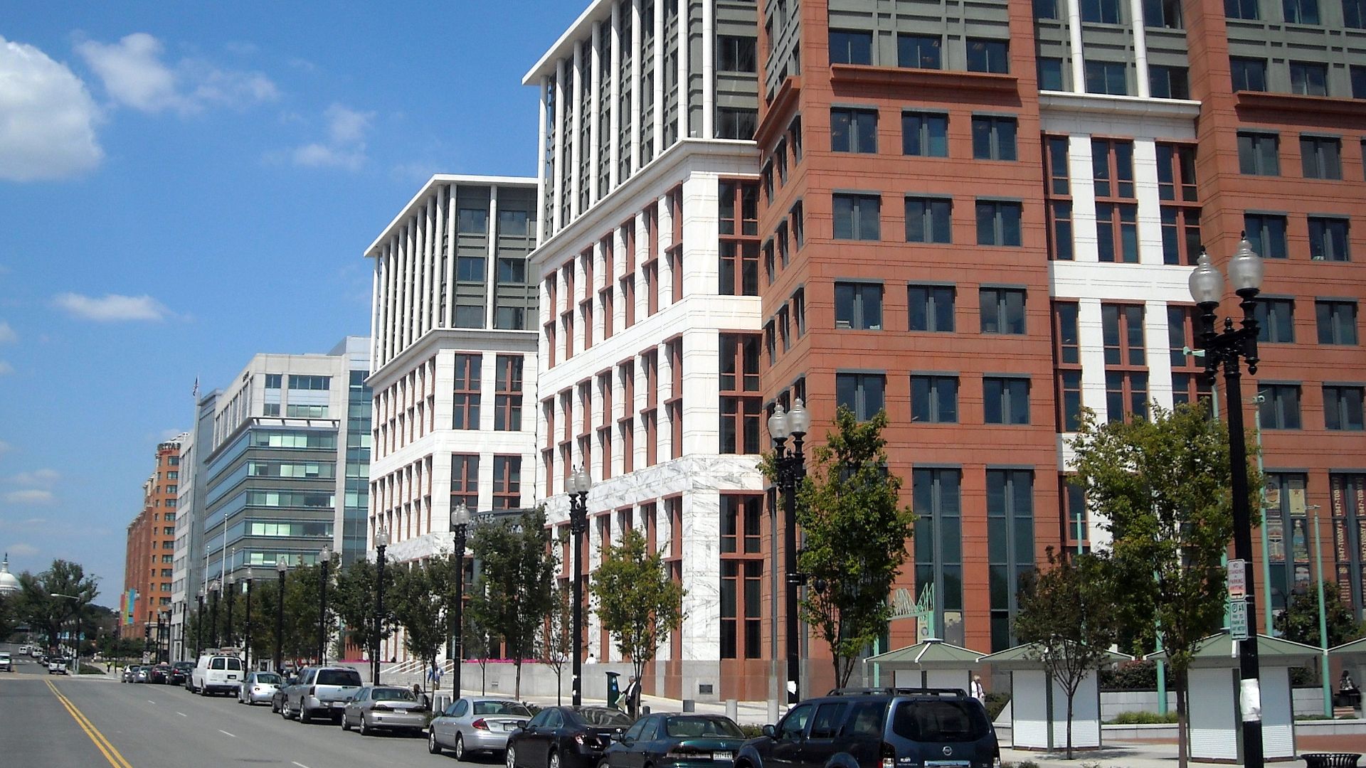 The United States Department of Transportation headquarters, located at 1200 New Jersey Avenue, S.E., in the Navy Yard neighborhood of Washington, D.C.  The dome of the United States Capitol is visible in the background.