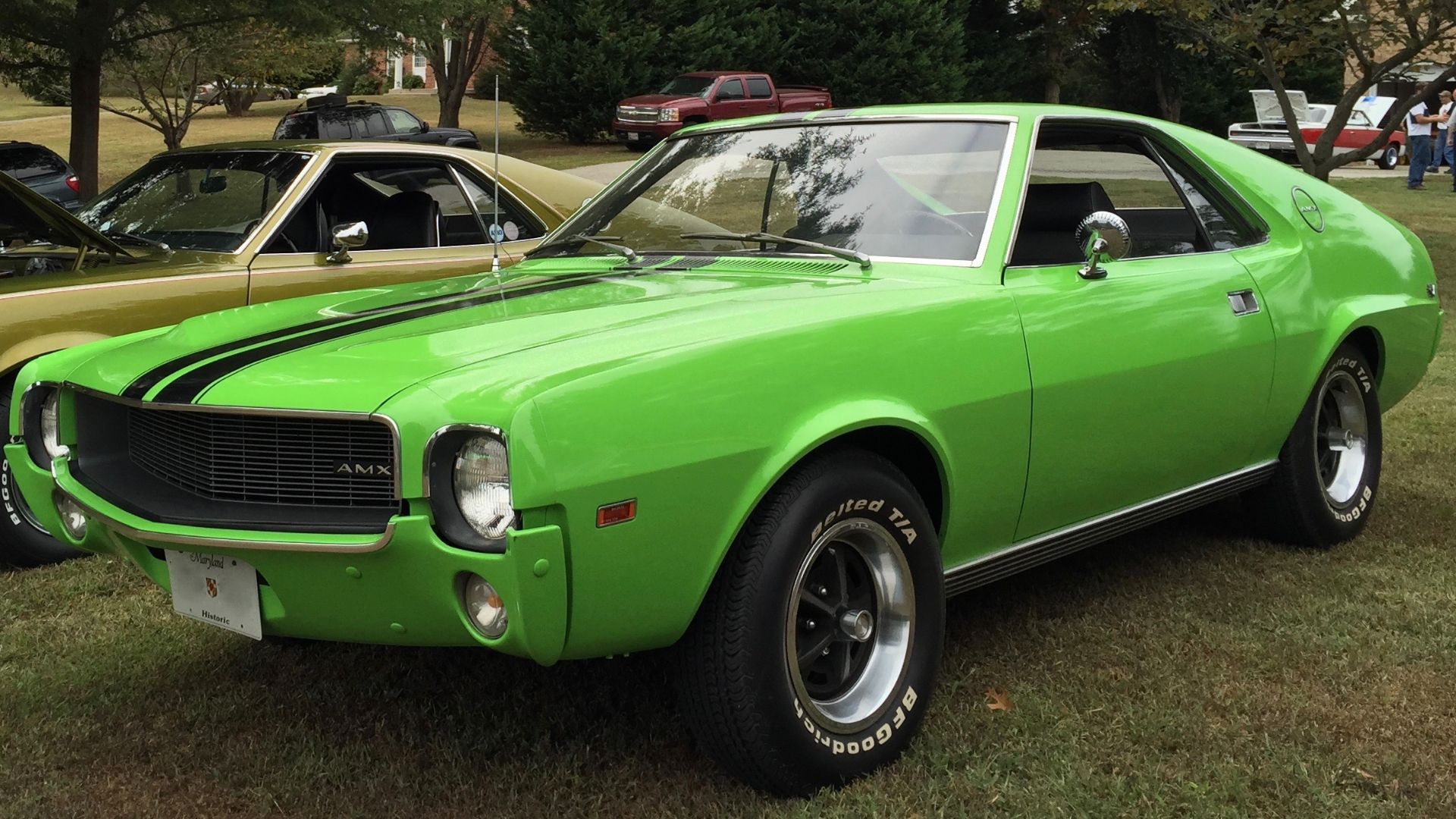 1969 AMC AMX, a two-seat muscle GT-type car built by American Motors Corporation in Kenosha, Wisconsin. It is finished in Big Bad Green, paint code P4 that was introduced for Spring 1969 - in mid-model year - and has the