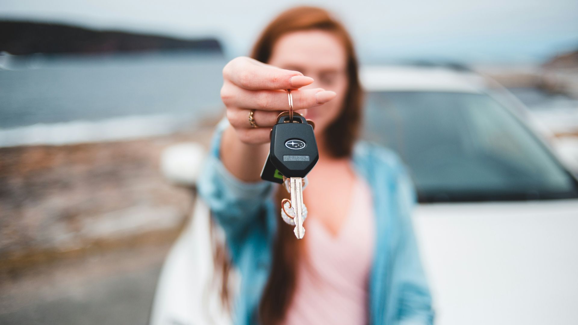 focus photography of black vehicle key