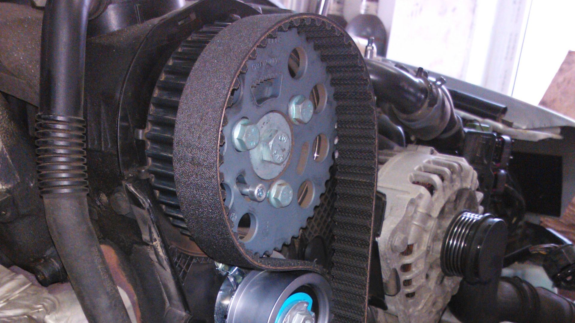 Replacing a timing belt of car.