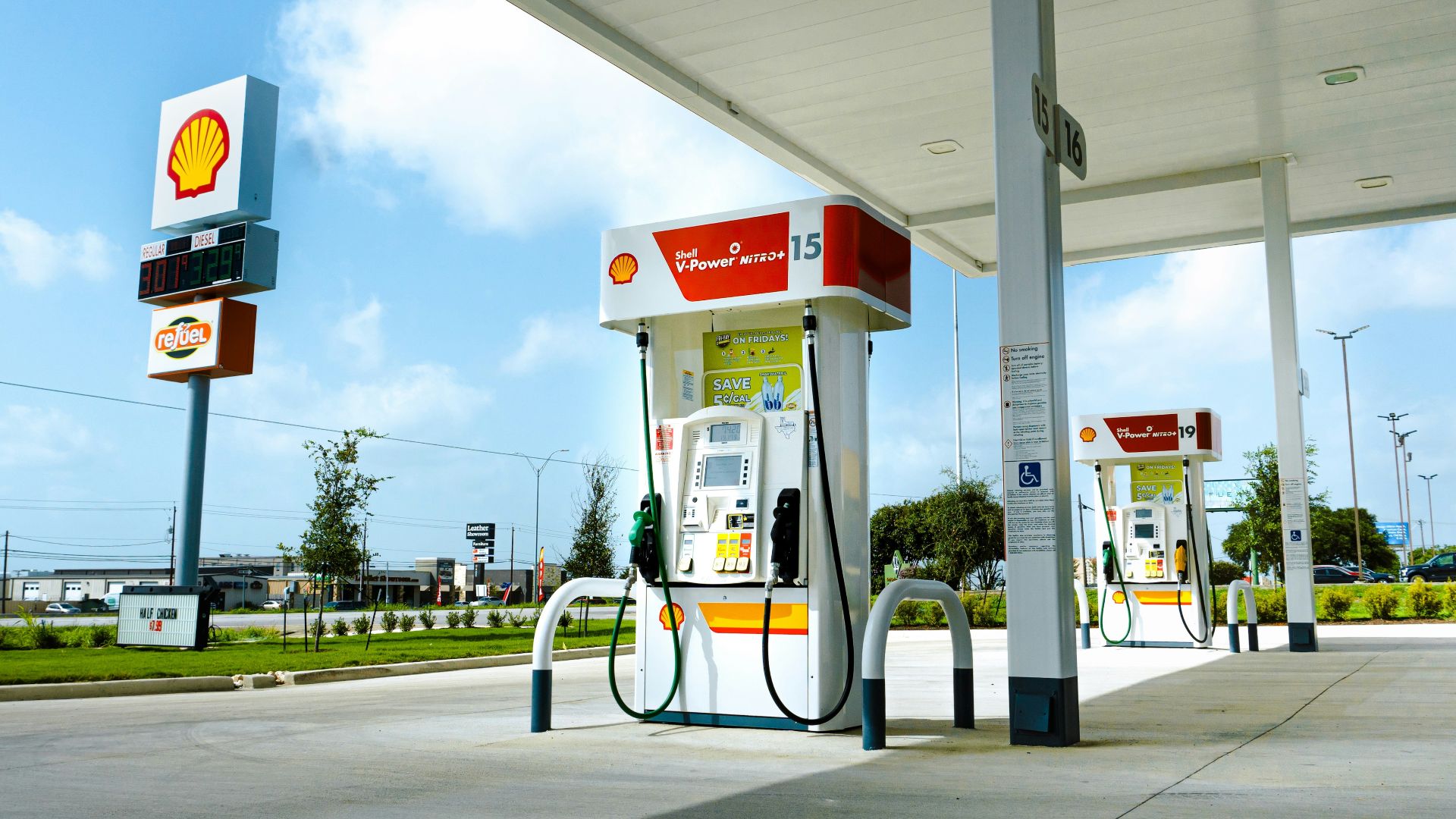 A gas station with a few gas pumps