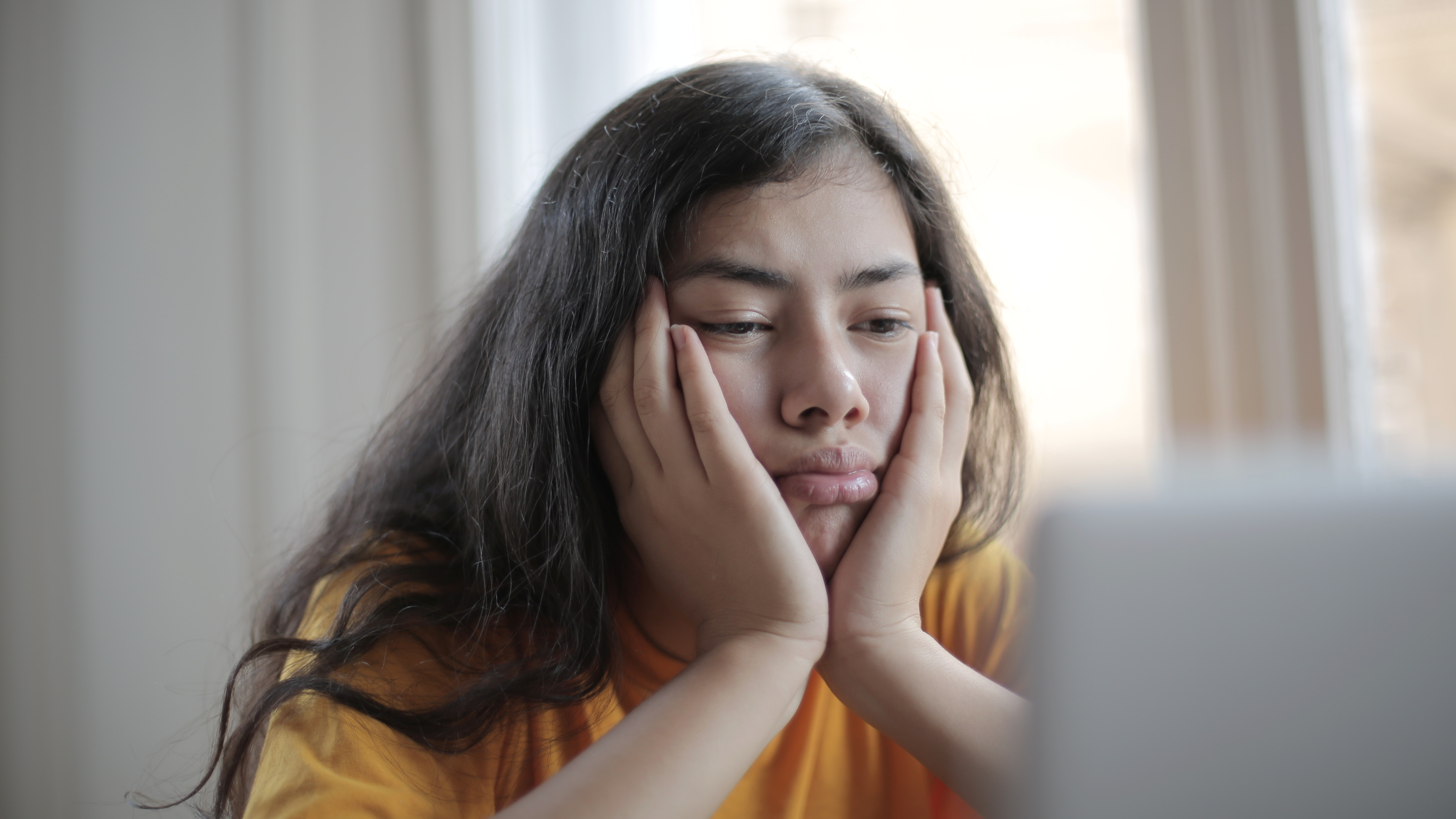 Tired person sitting in front of computer