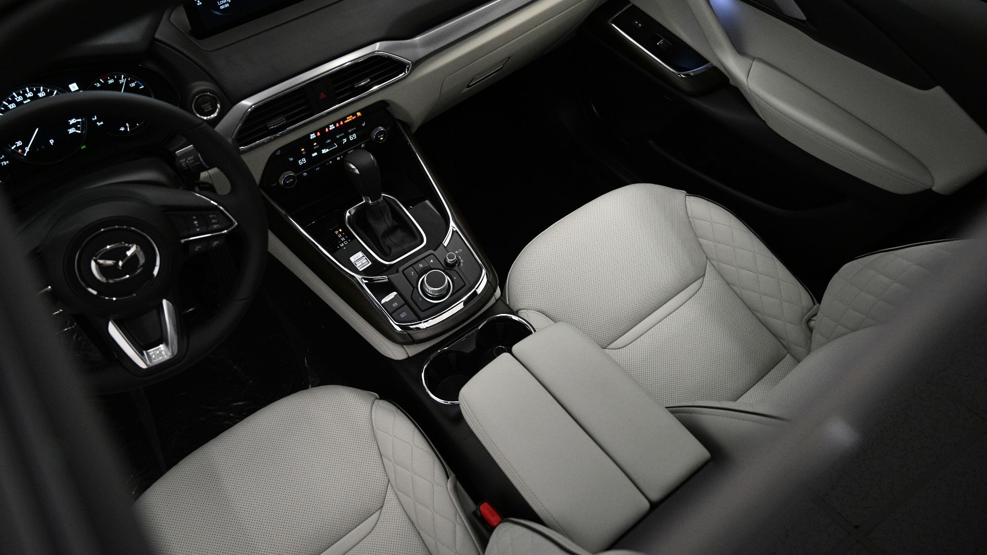 the interior of a car with a steering wheel and dashboard