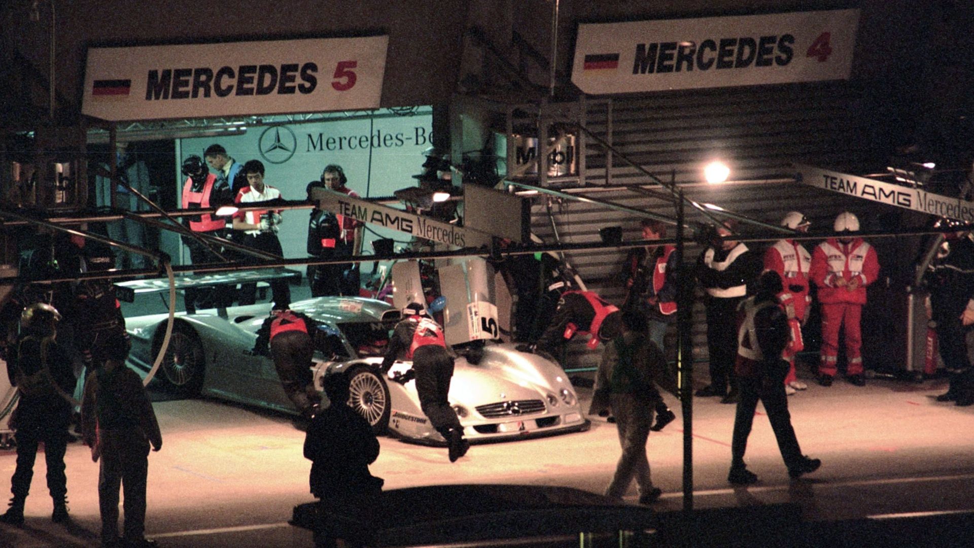 Mercedes-Benz CLR - Christophe Bouchut, Nick Heidfeld & Peter Dumbreck is pushed back into the garage during practice at the 1999 Le Mans