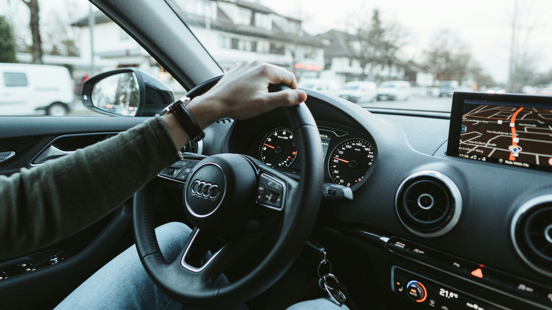 person driving car during daytime