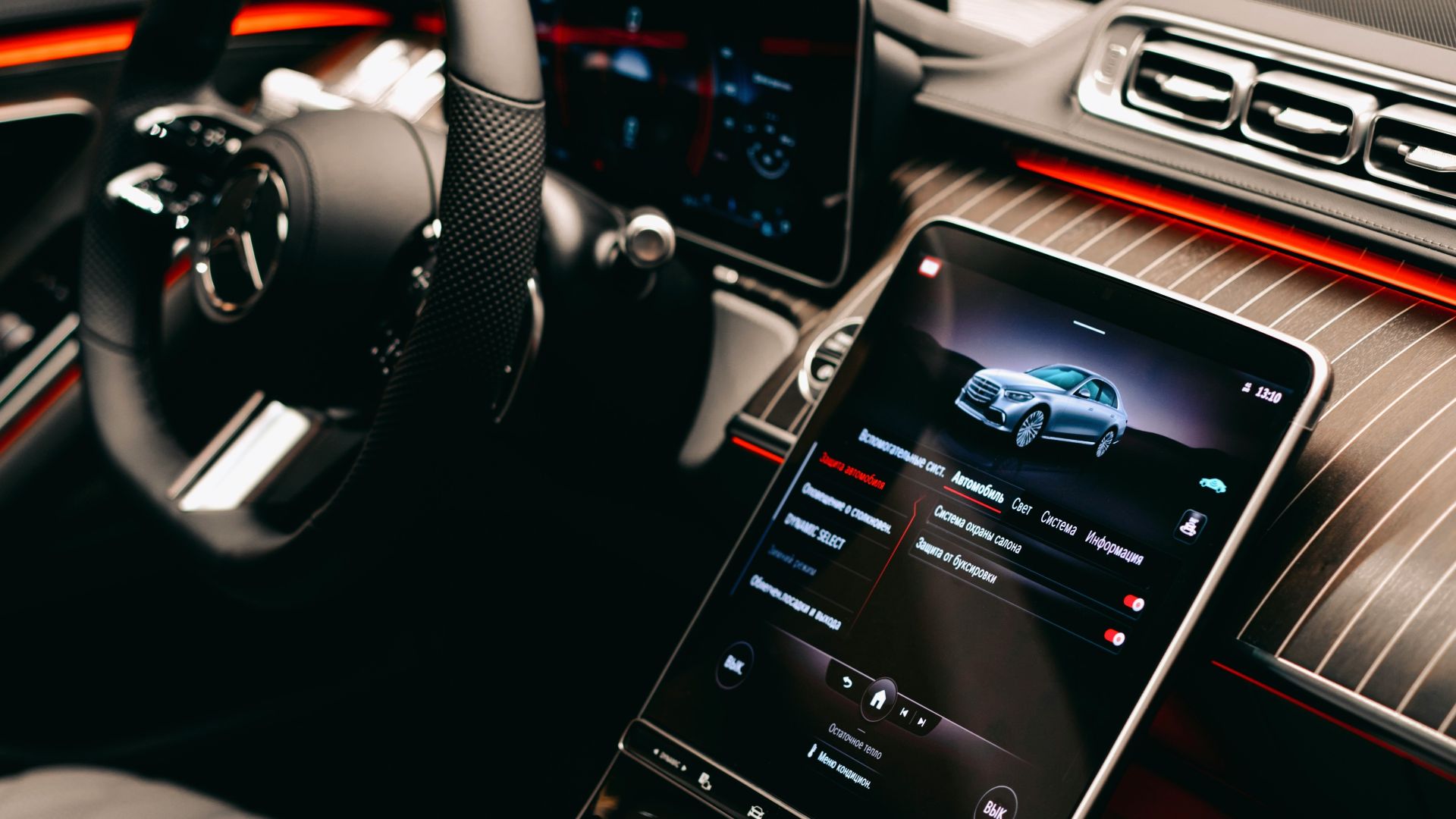 a car dashboard with a cell phone in the center