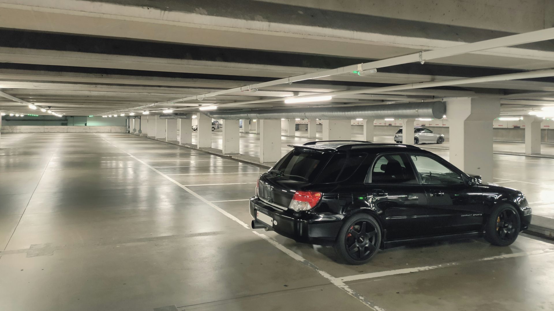 black suv in a parking lot