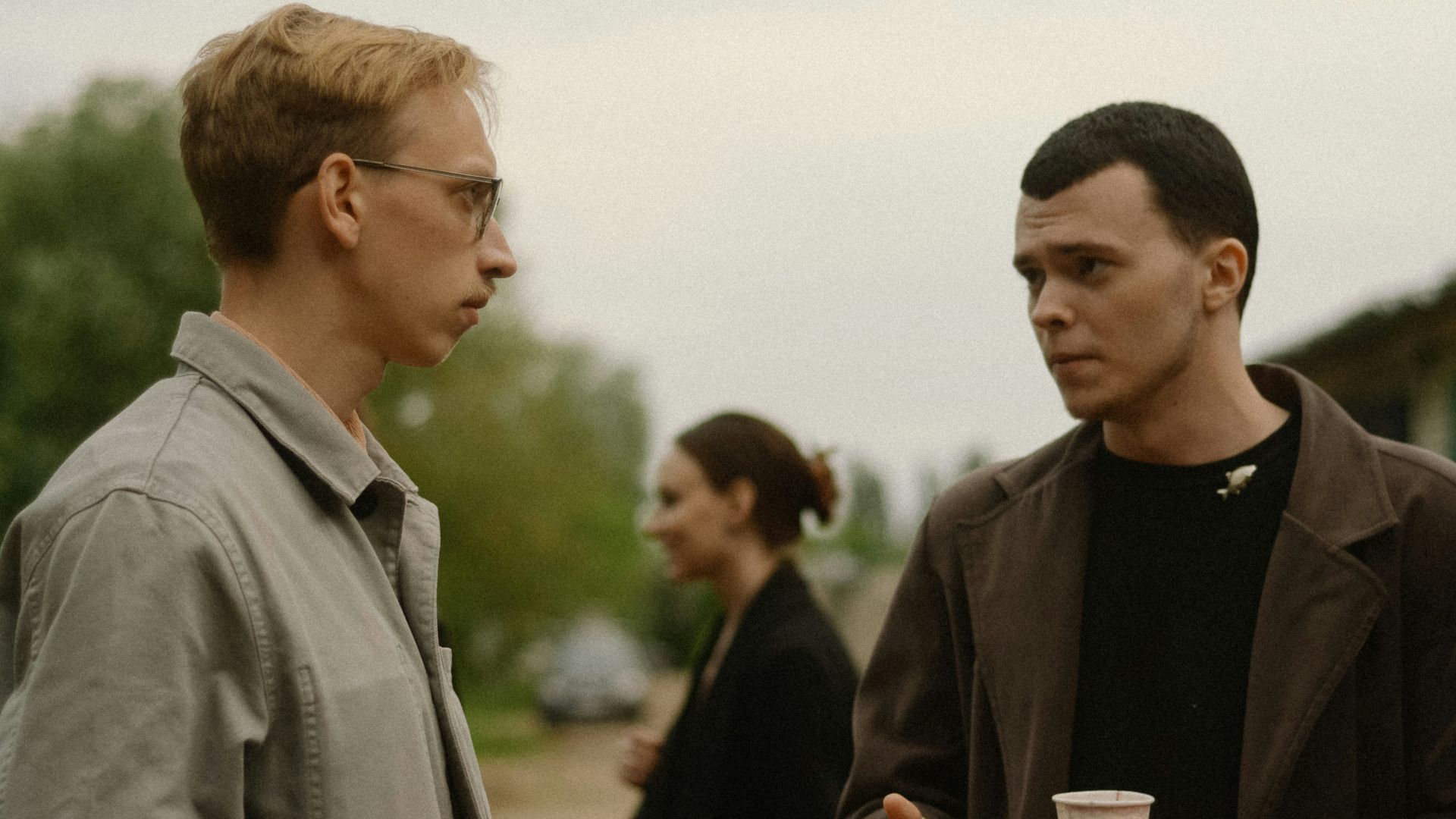 a couple of men standing next to each other