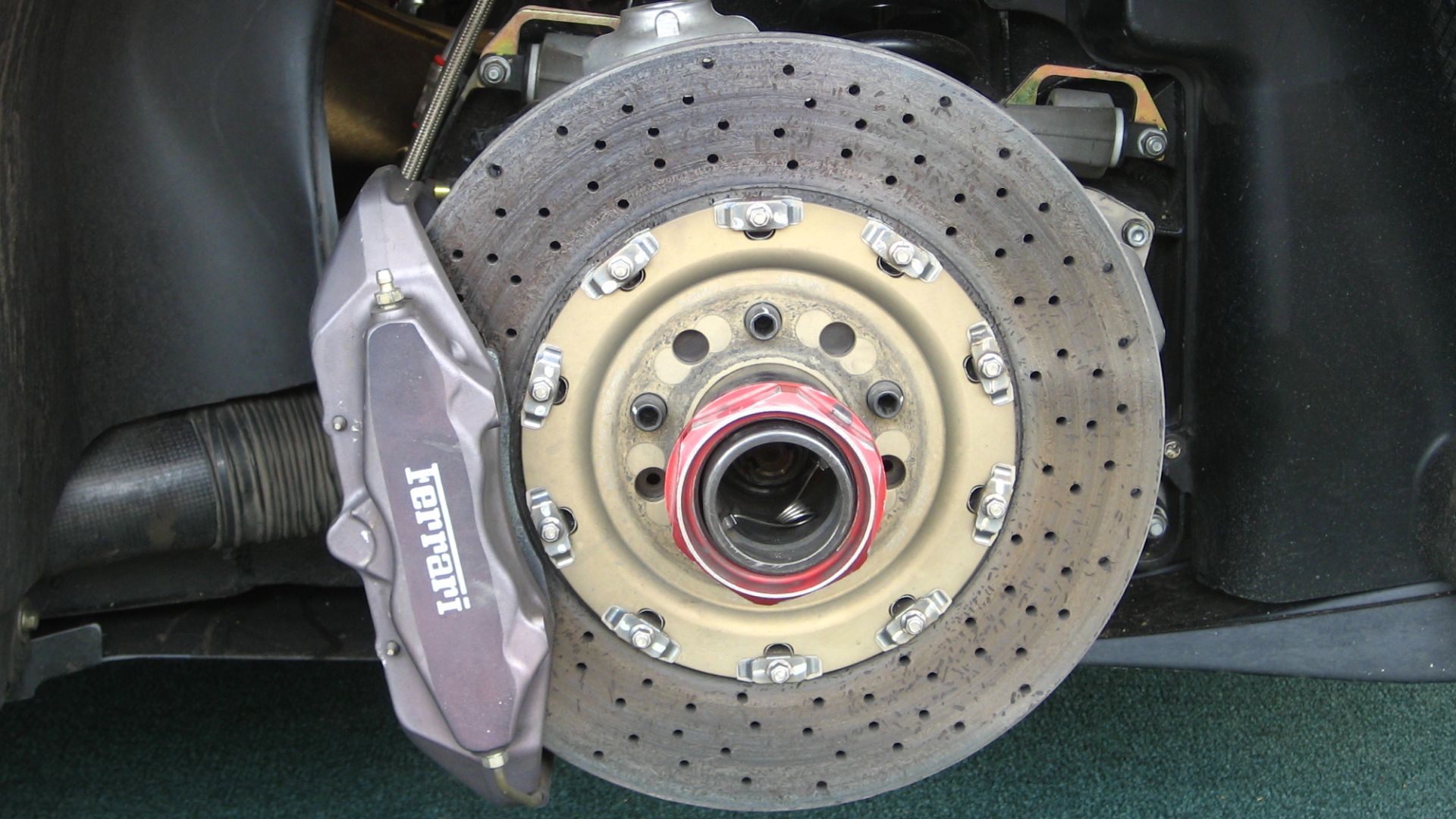 The disc brake assembly of a Ferrari F430 Challenge at New Jersey Motorsports Park.