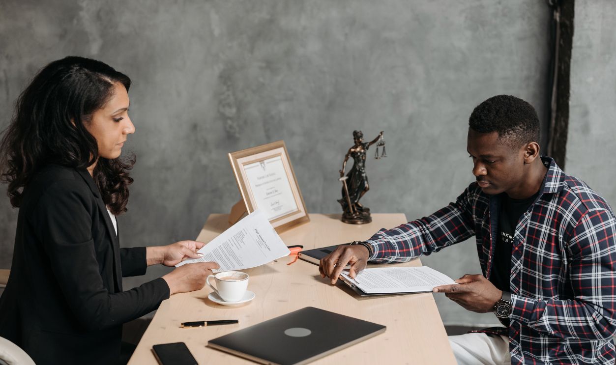 Business professionals discussing documents in a modern office 