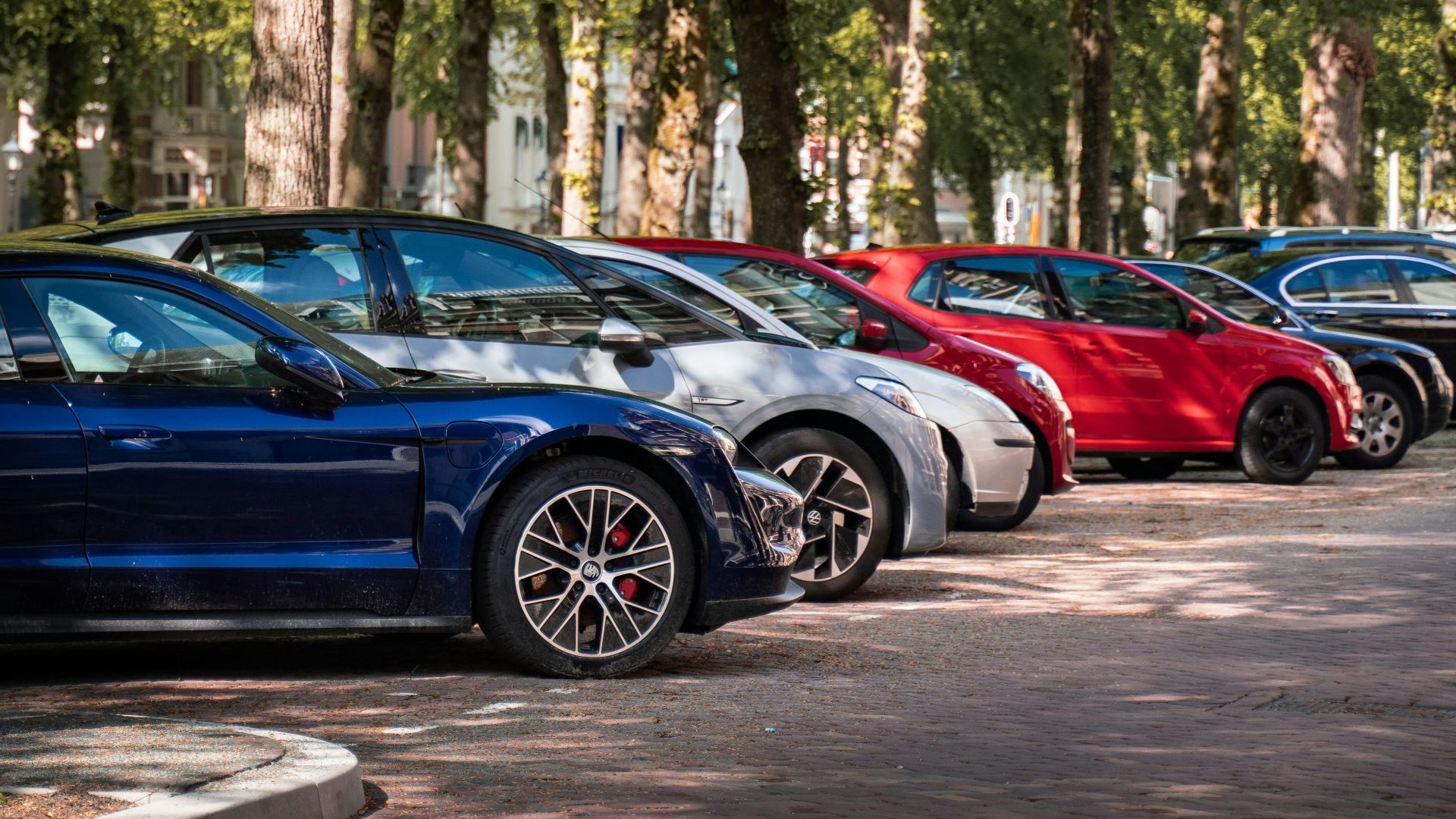 blue and red sports car on road during daytime