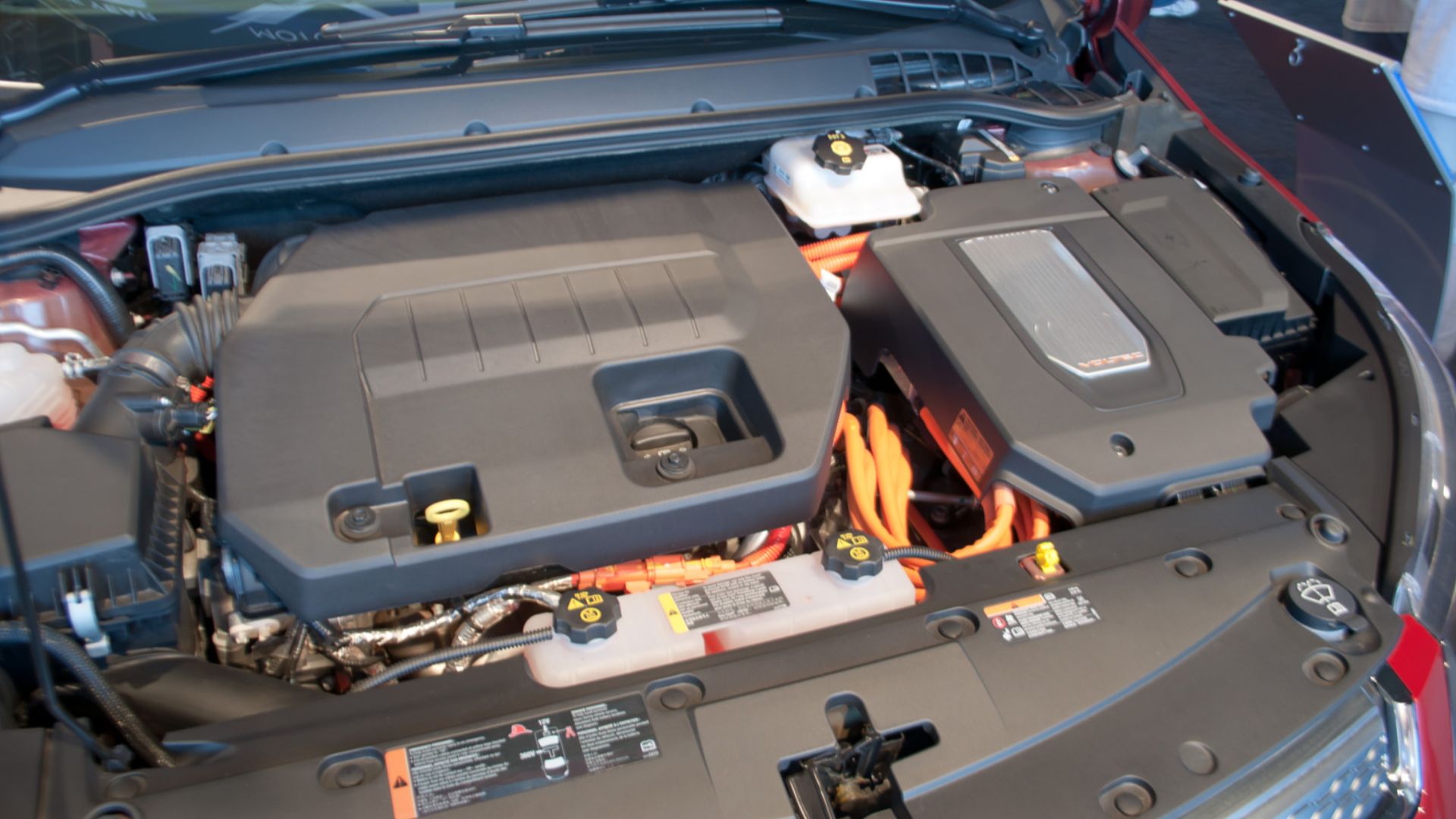 The engine compartment of the Chevrolet Volt plug-in hybrid.
While previous gasoline-electric hybrid vehicles were primarily powered by the gasoline engine, with the electric motor used for regenerative braking and engine assist, the Volt goes a step furt
