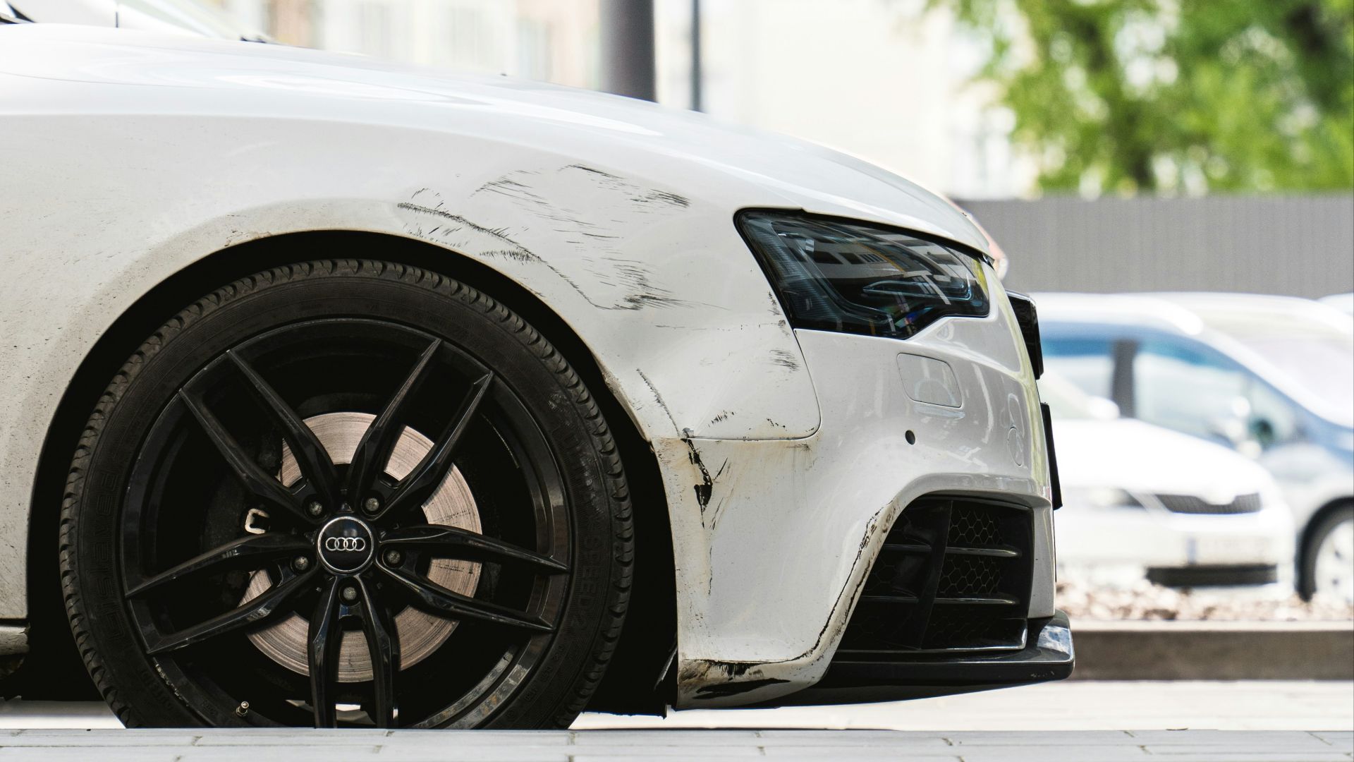 a white car parked on the side of the road