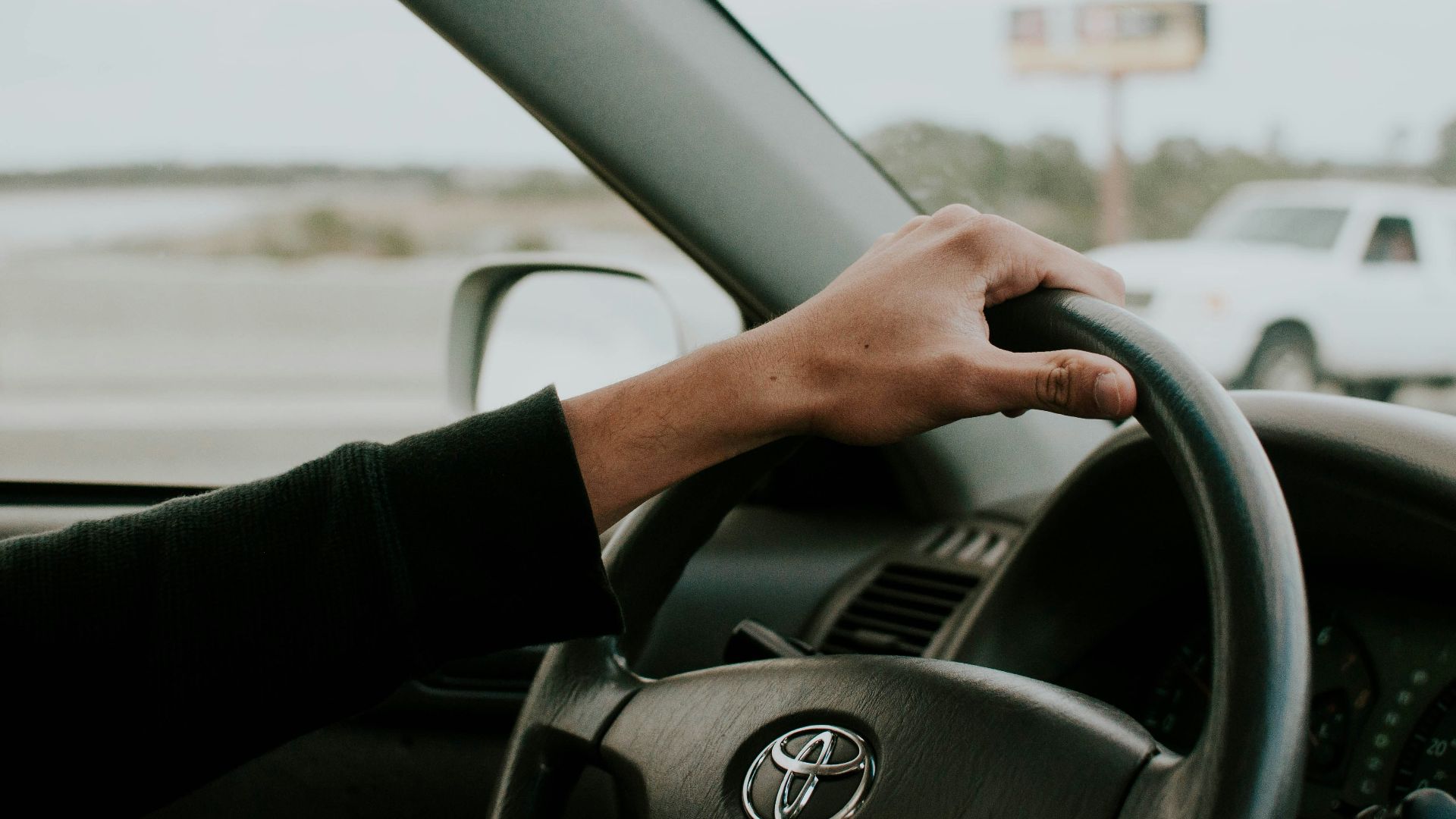 person driving Toyota car
