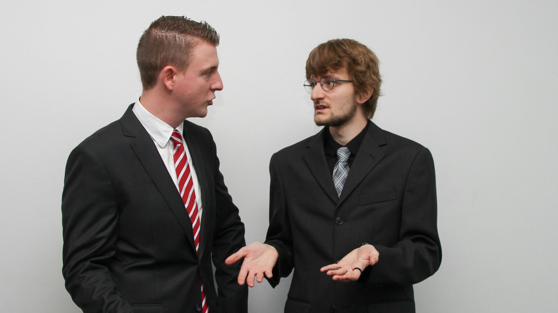 man wearing black suit jacket