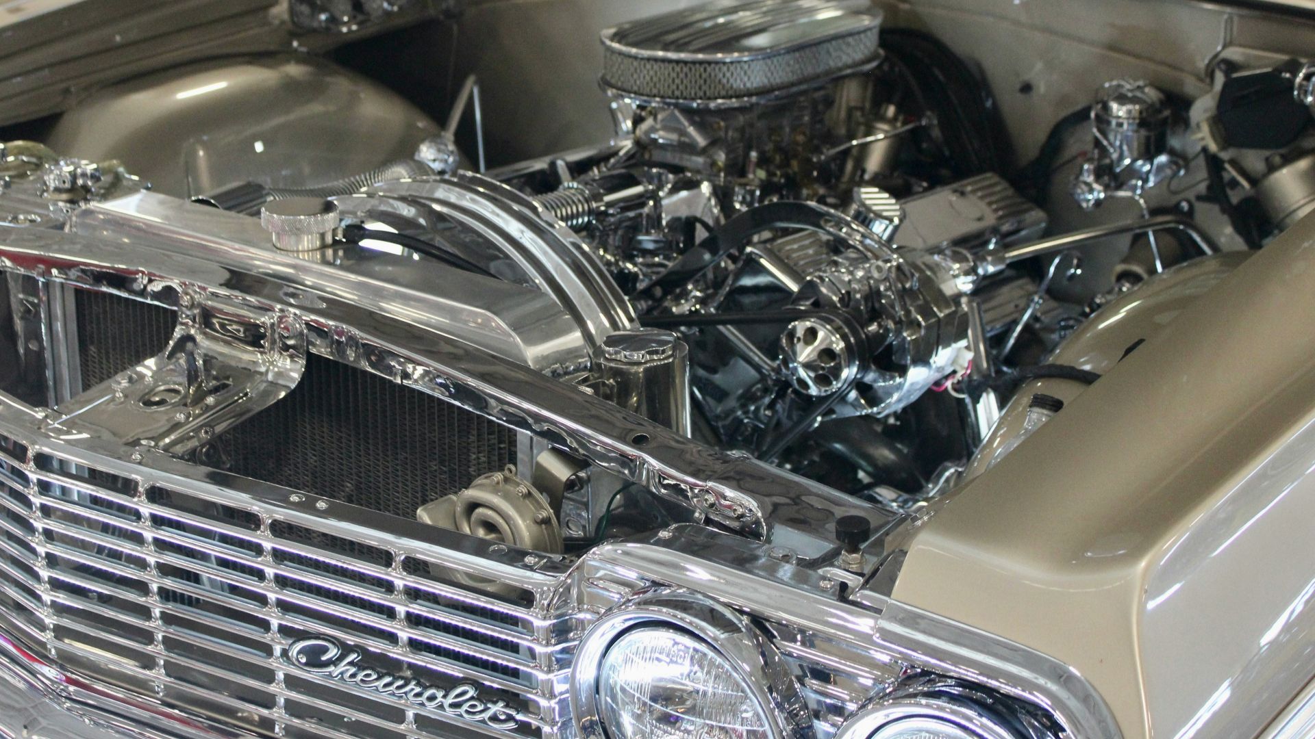 Chrome engine and grille of a classic chevrolet car